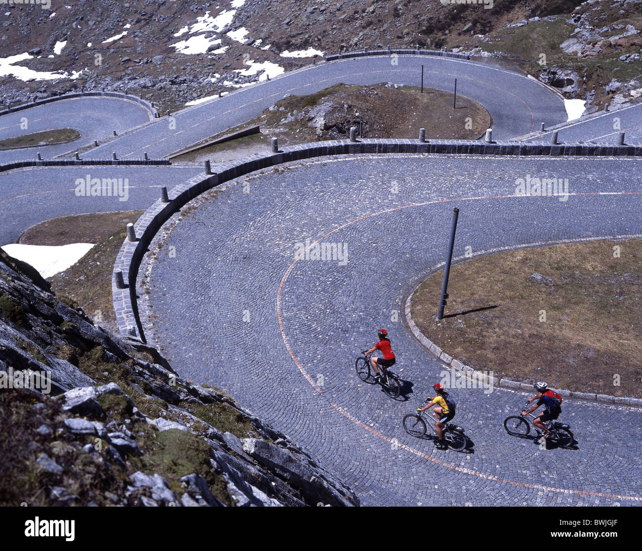 bikers serpentines mountain bike curves alpine pass Gotthard street pass Gotthardpass Canton Ticino bicycle Stock Photo