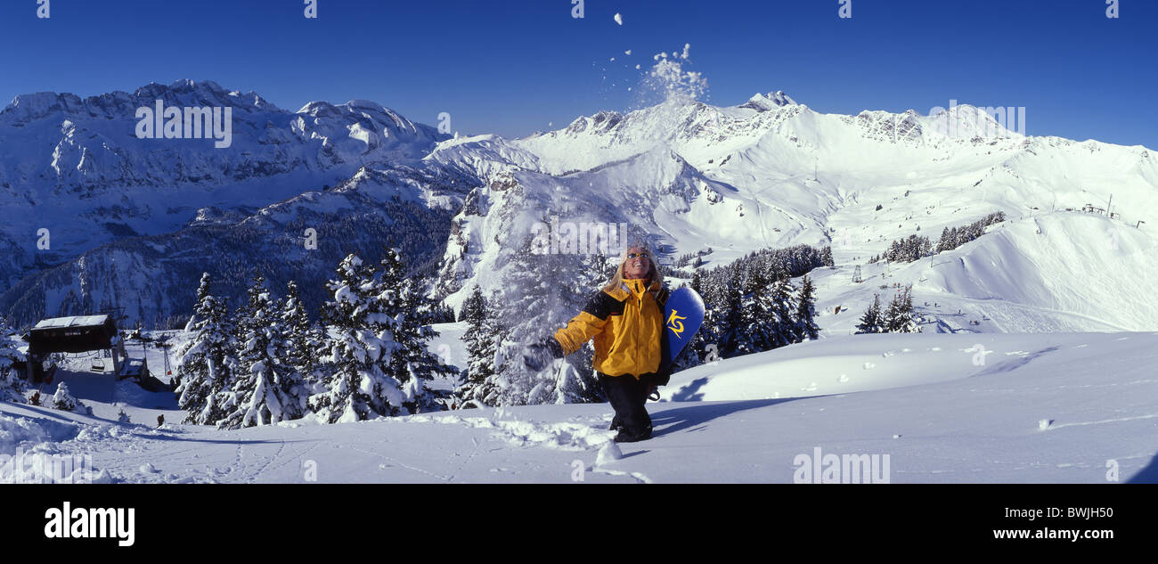 Porte du Soleil Canton Valais woman Snowboarder joy fun joke snowboard snow fresh snowfall mountains Alps Stock Photo