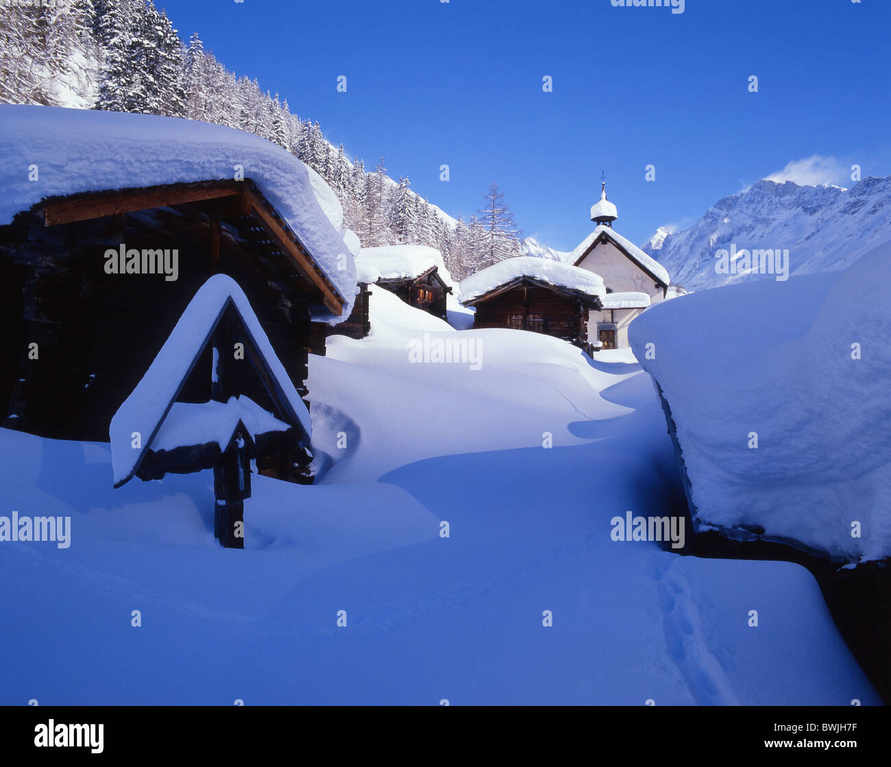Lotschental hamlet Kuhmad settlement snowbound snow-covered snowy fresh snowfall snow cross village mountai Stock Photo