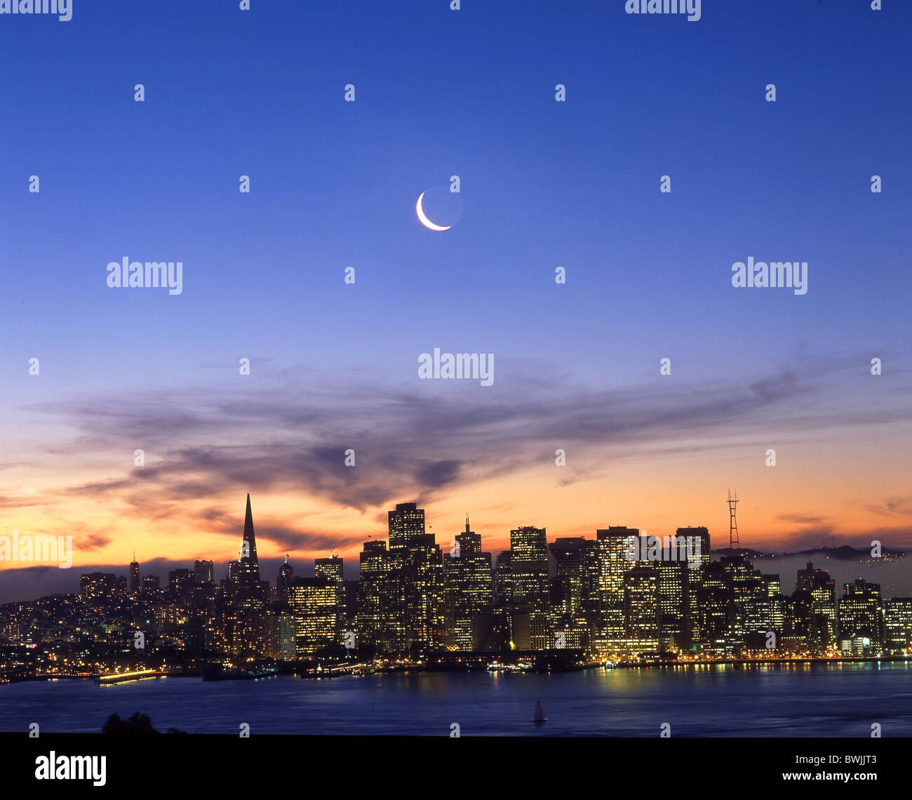 San Francisco skyline moon crescent at night nacht dusk twilight town city California USA America United Stock Photo