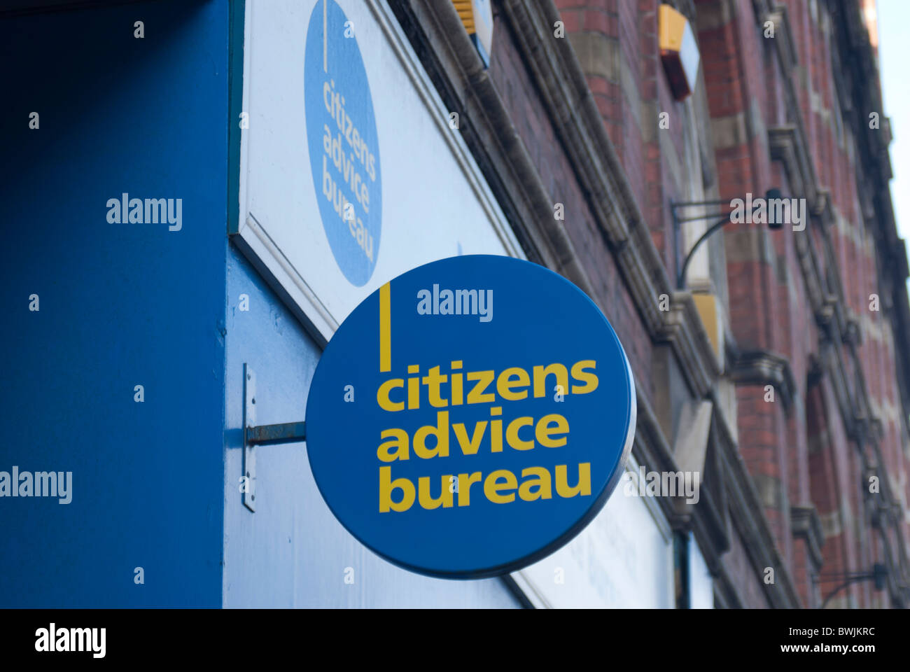 A Citizens Advice Bureau sign suspended on a wall Stock Photo Alamy