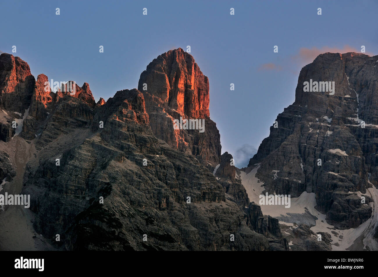 Alpenglow at sunset over the mountain Monte Cristallo in the Dolomites, Italy Stock Photo