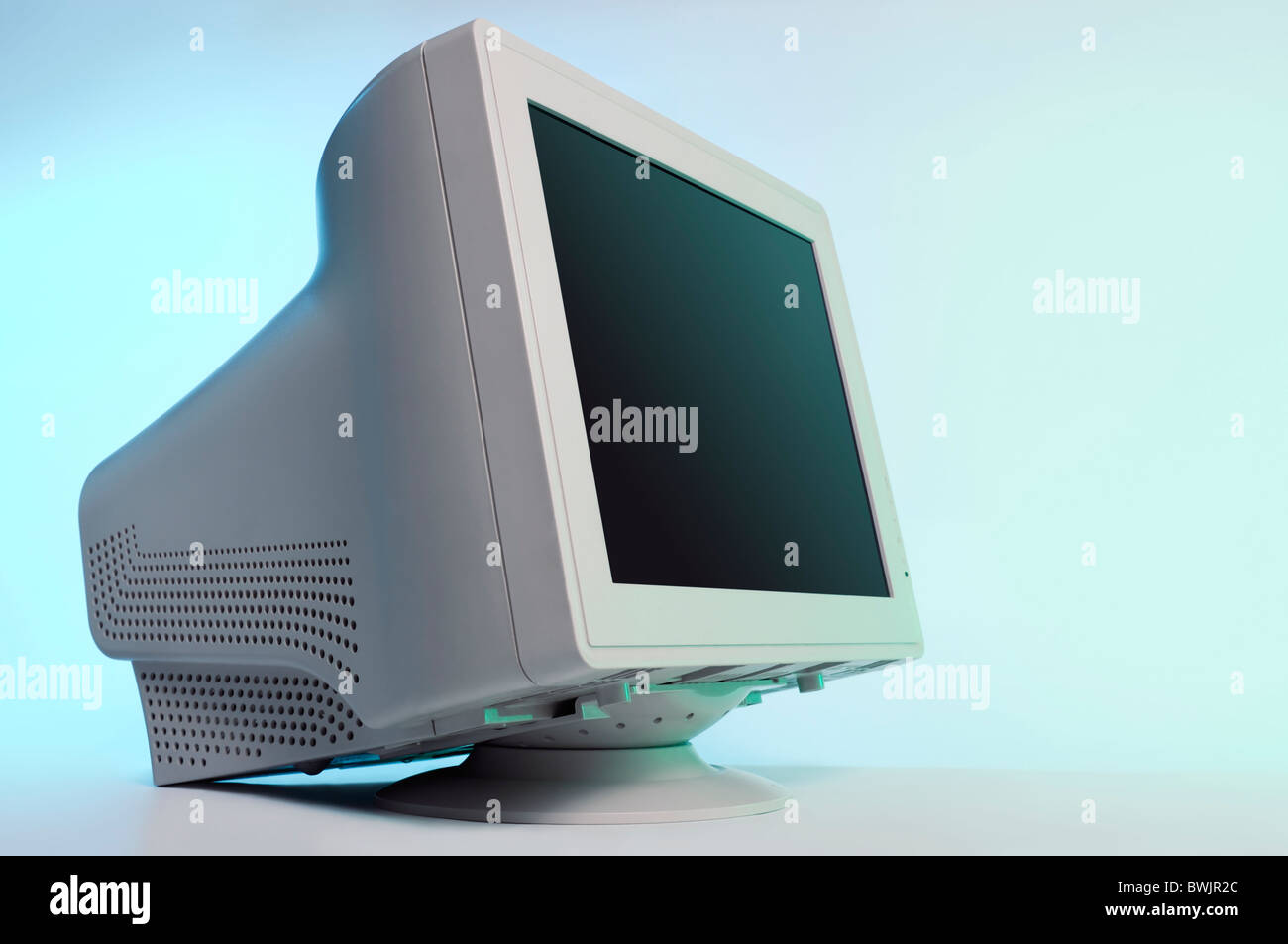 CRT computer monitor isolated on blue background with a clipping path Stock Photo