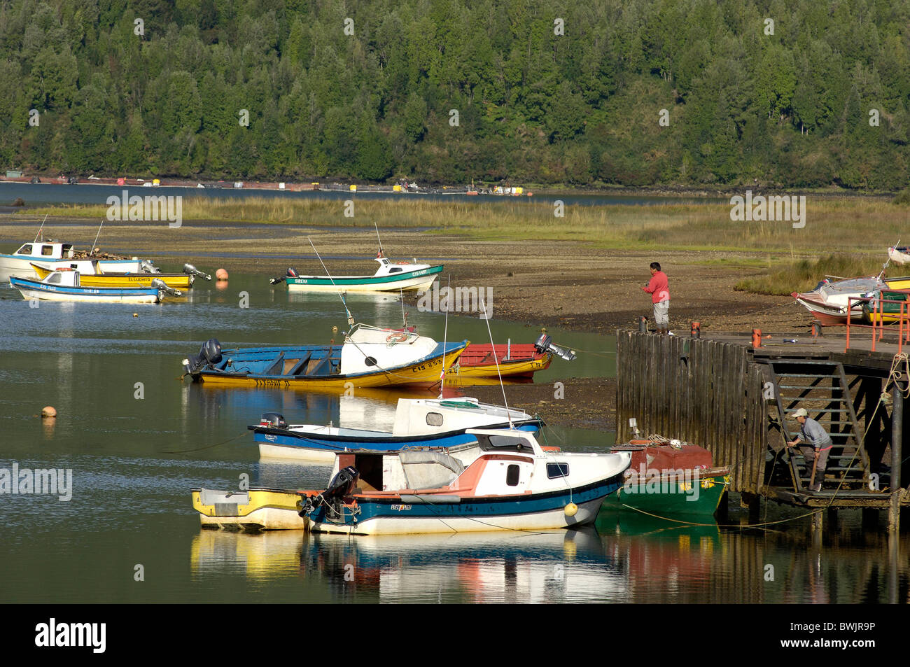boats people Fischer Canal Puyuhuapi Puyuhuapi Aisen Patagonia Chile Stock Photo