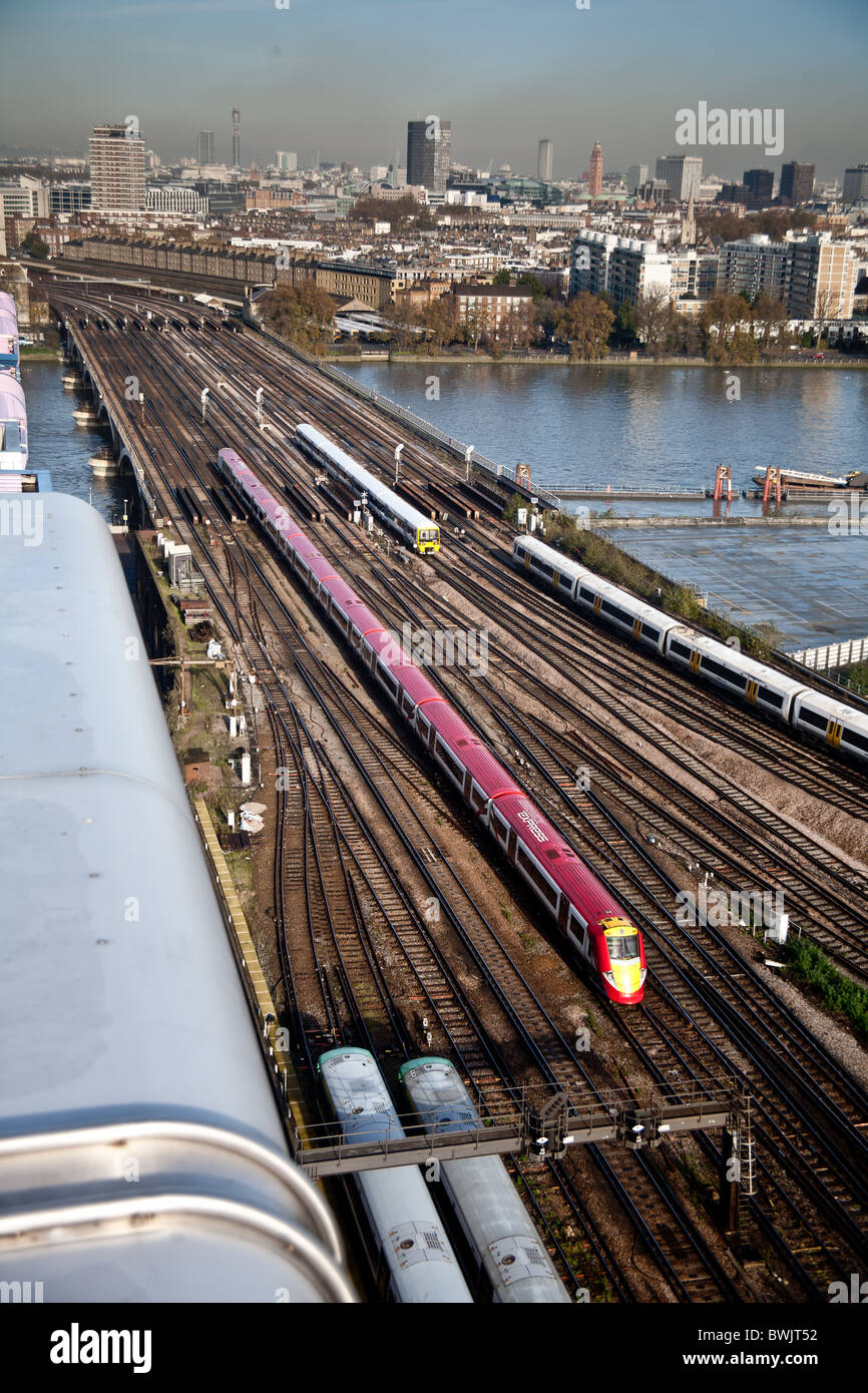 Gatwick Express,Southern and Southeastern trains traveling along the tracks by Battersea Power Station, Stock Photo