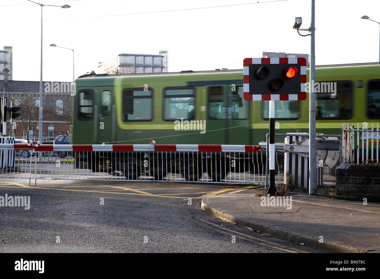 Dart Train Going Over Road Level Crossing Outside Dublin Republic Of Ireland Stock Photo Alamy