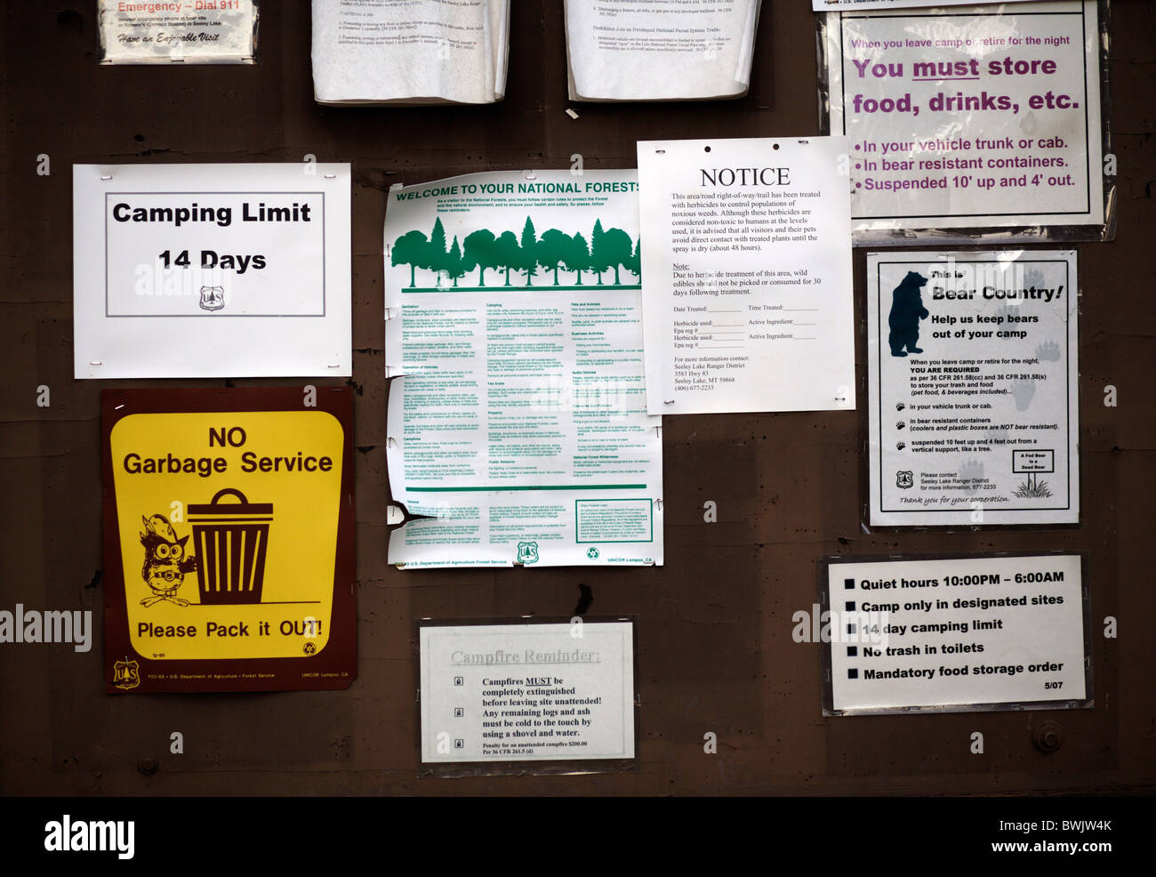 Notices on a campground noticeboard in the United States of America warning of bear activity Stock Photo