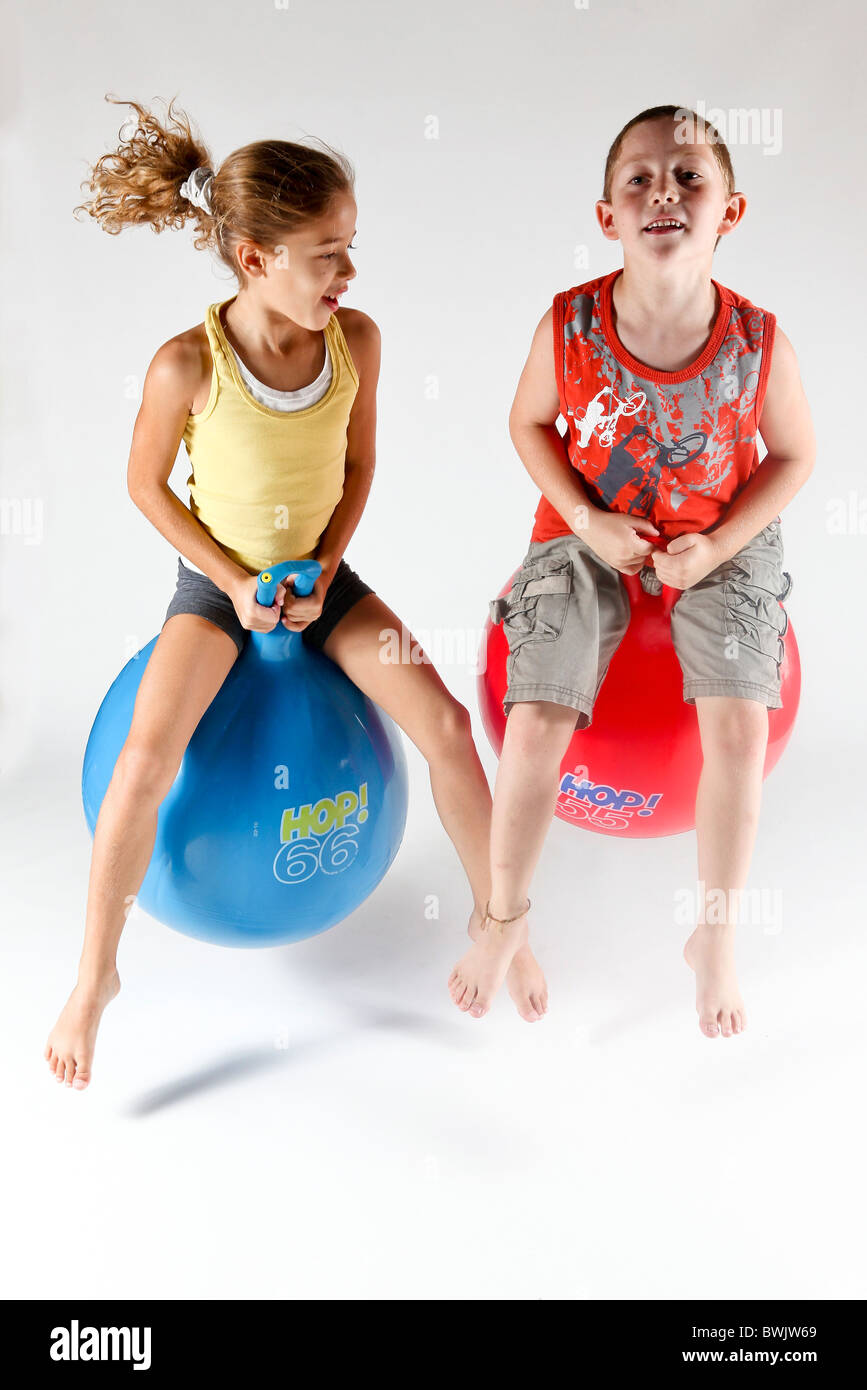 Indoor playground child on Space hopper On white Background Stock Photo