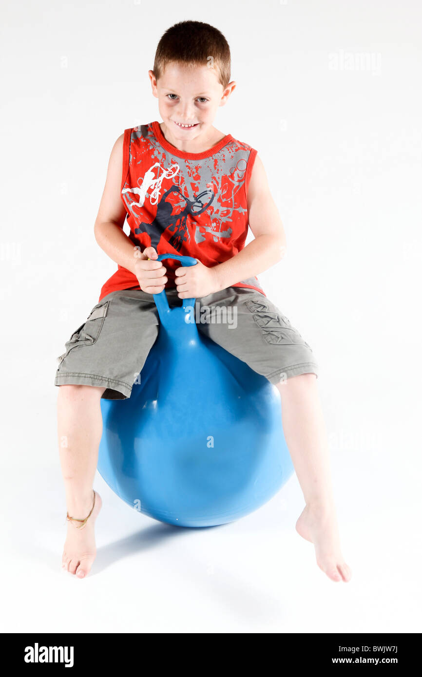 Indoor playground child on Space hopper On white Background Stock Photo