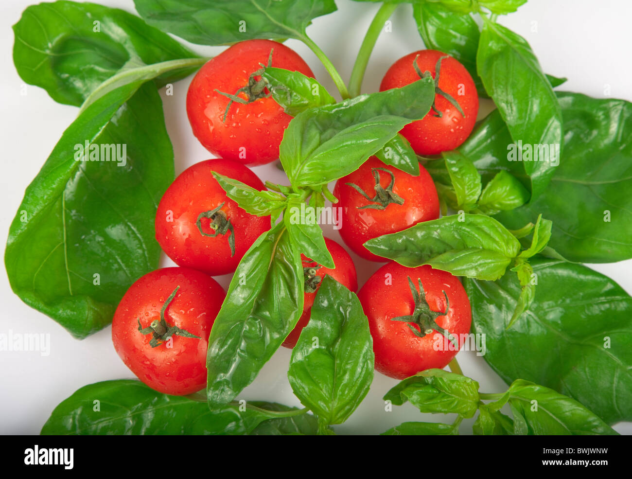 Healthy Eating With Fresh tomatoes and Basil Stock Photo - Alamy