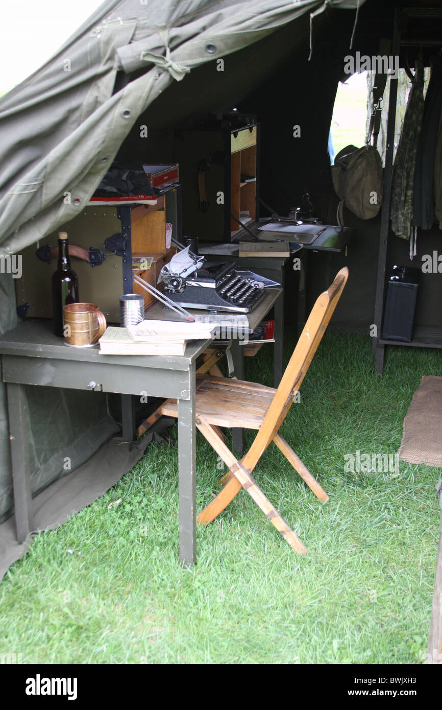 A World War II WWII tent camp with a typewriter on the desk Stock Photo