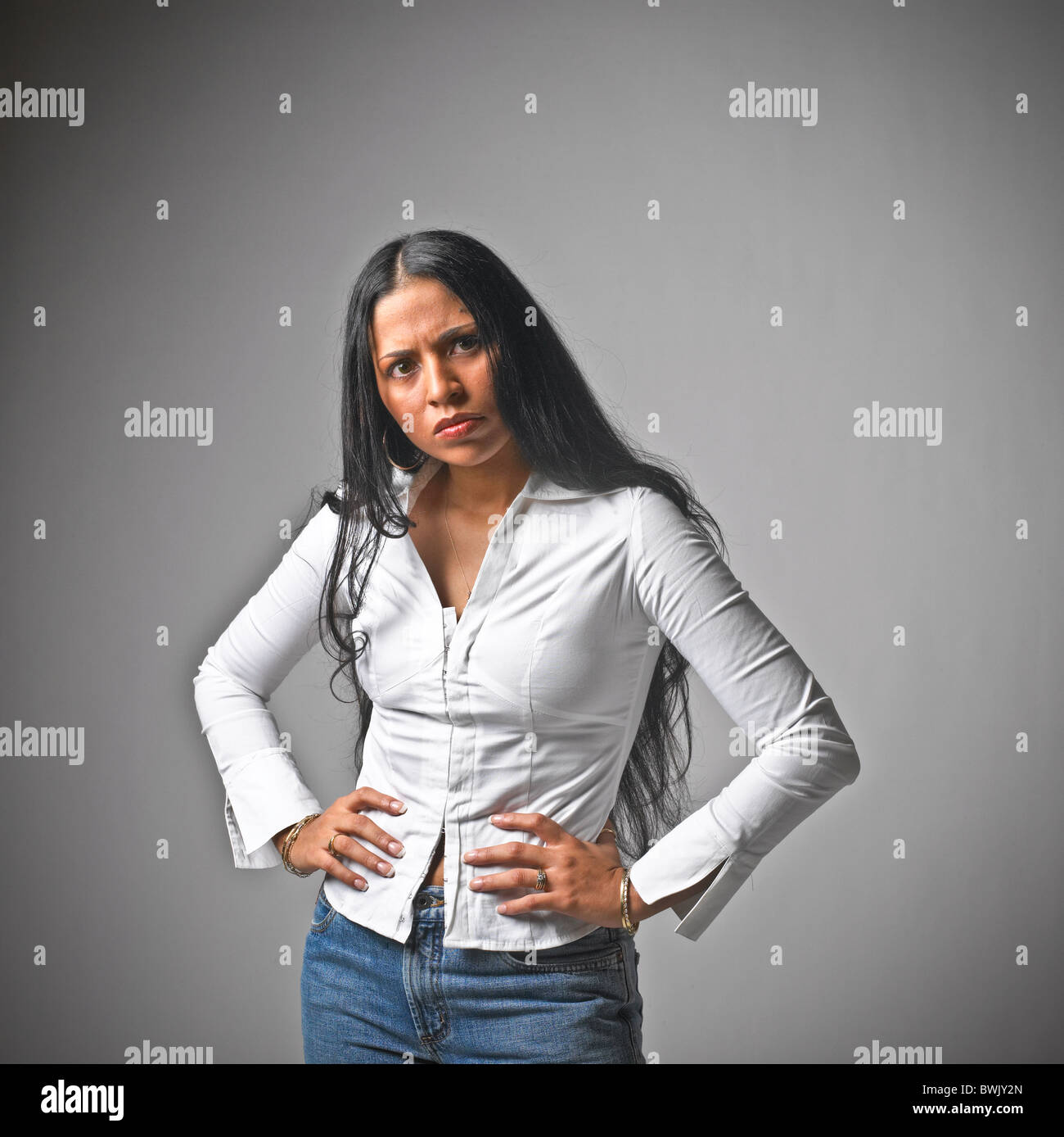 Young Hispanic woman female casual clothes, jeans, body language, hands