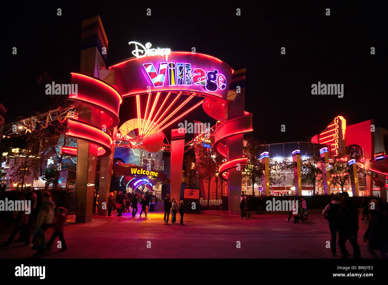 The entrance to the Disney Village at night, Disneyland Paris, France Stock Photo