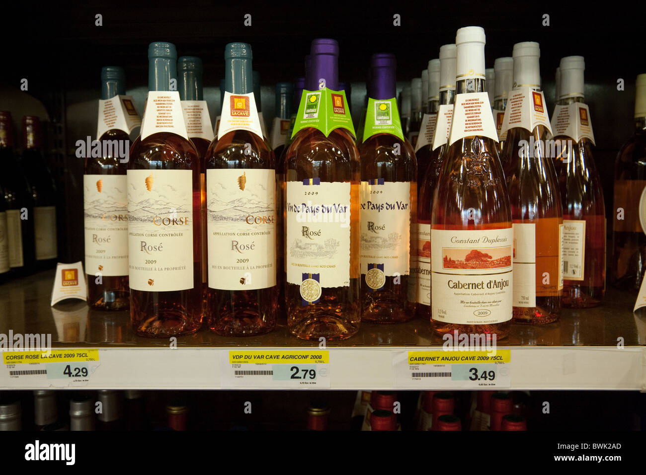 Bottles of french Rose wine on the shelves for sale in a french
