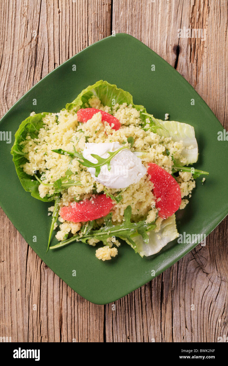 Couscous salad with poached egg on top Stock Photo Alamy