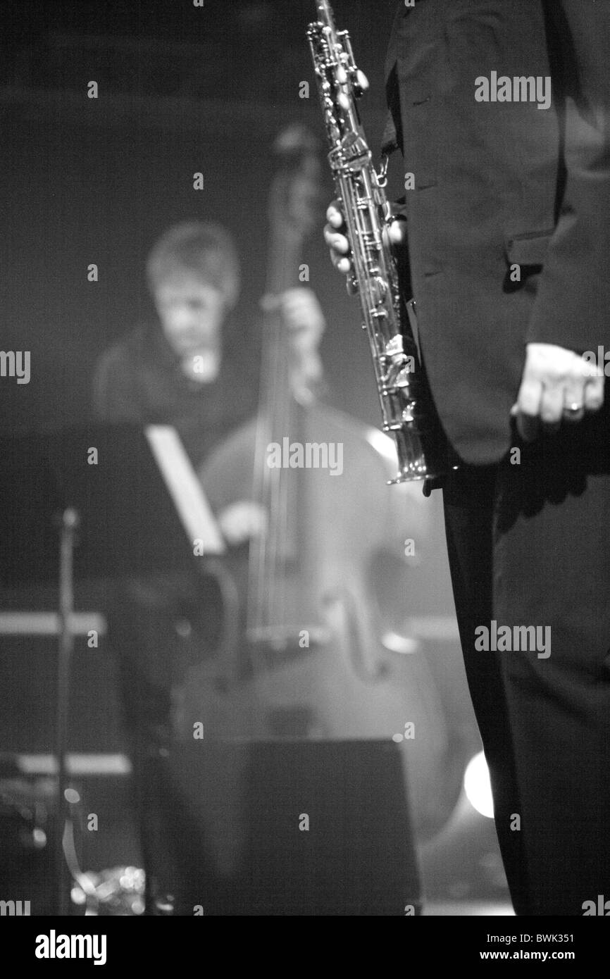 musician on the stage under spotlight Stock Photo