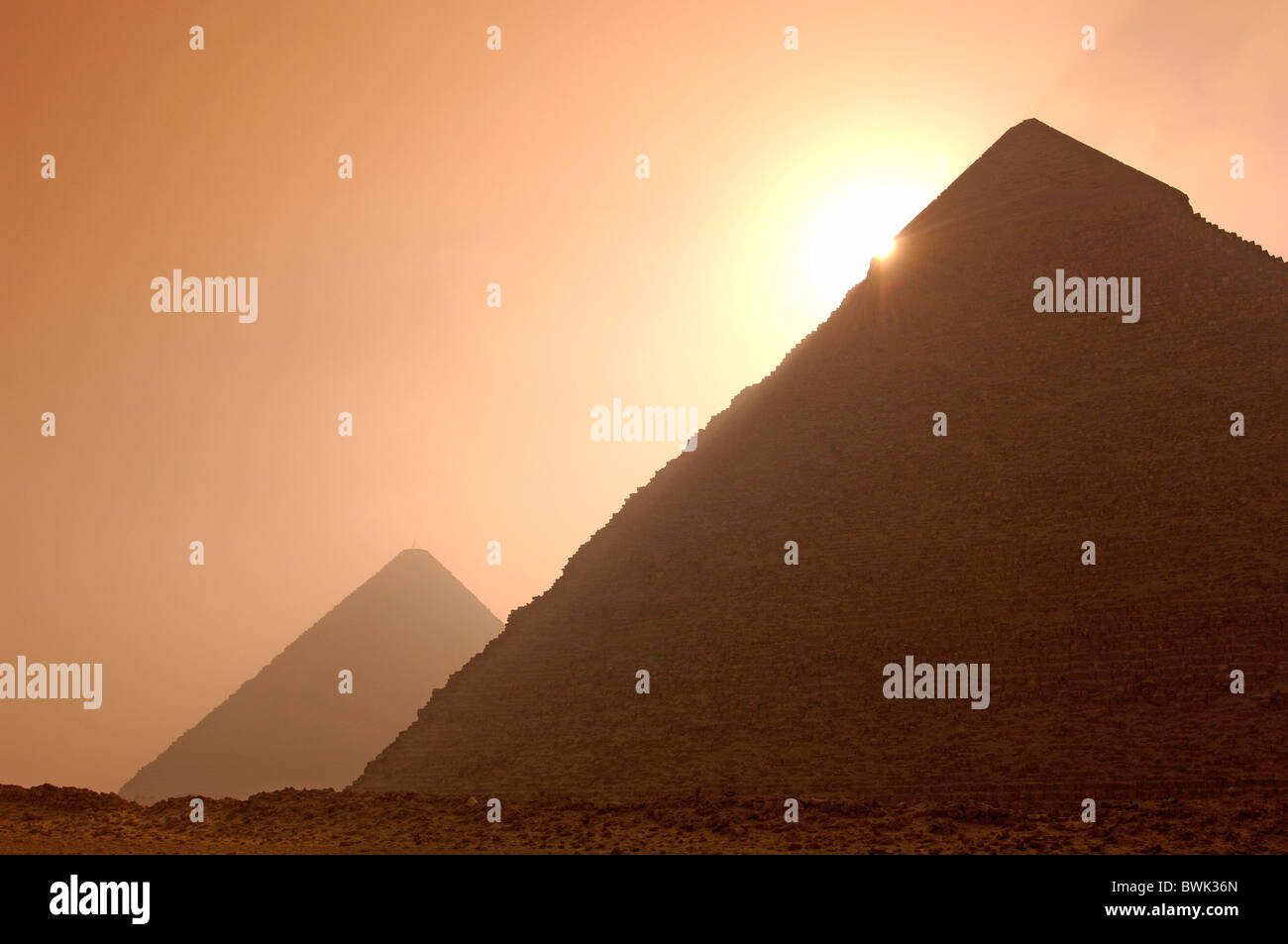 pyramids Gizeh silhouettes back light mood dusk twilight Cairo Egypt North Africa Stock Photo