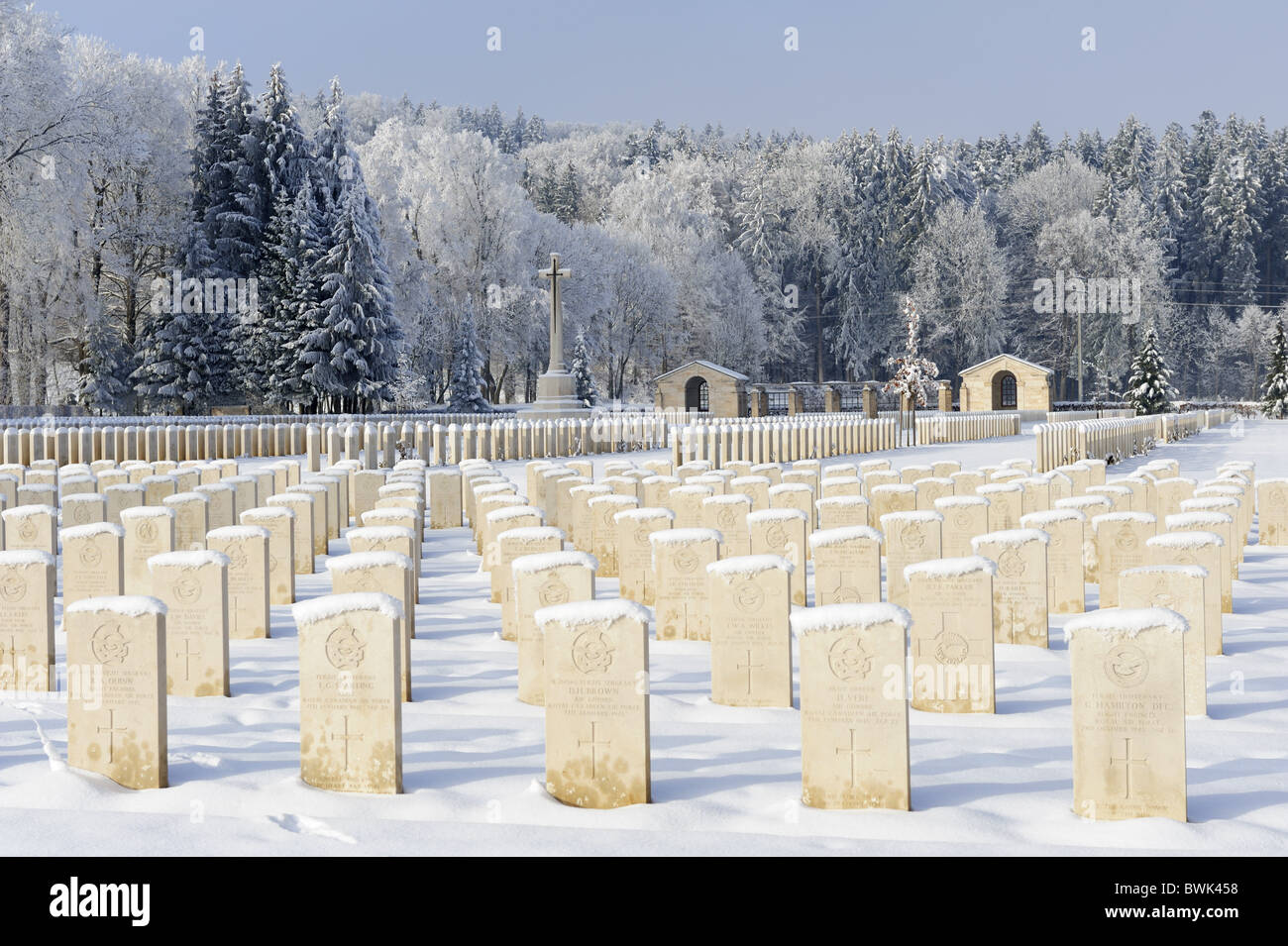 Snow covered graves and cross in Durnbach war cemetery, lake Tegernsee, Duernbach, Upper Bavaria, Bavaria, Germany Stock Photo