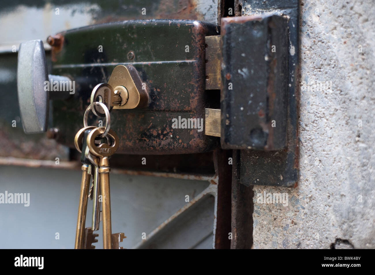Keys in Old Metal Door Lock Stock Photo Alamy