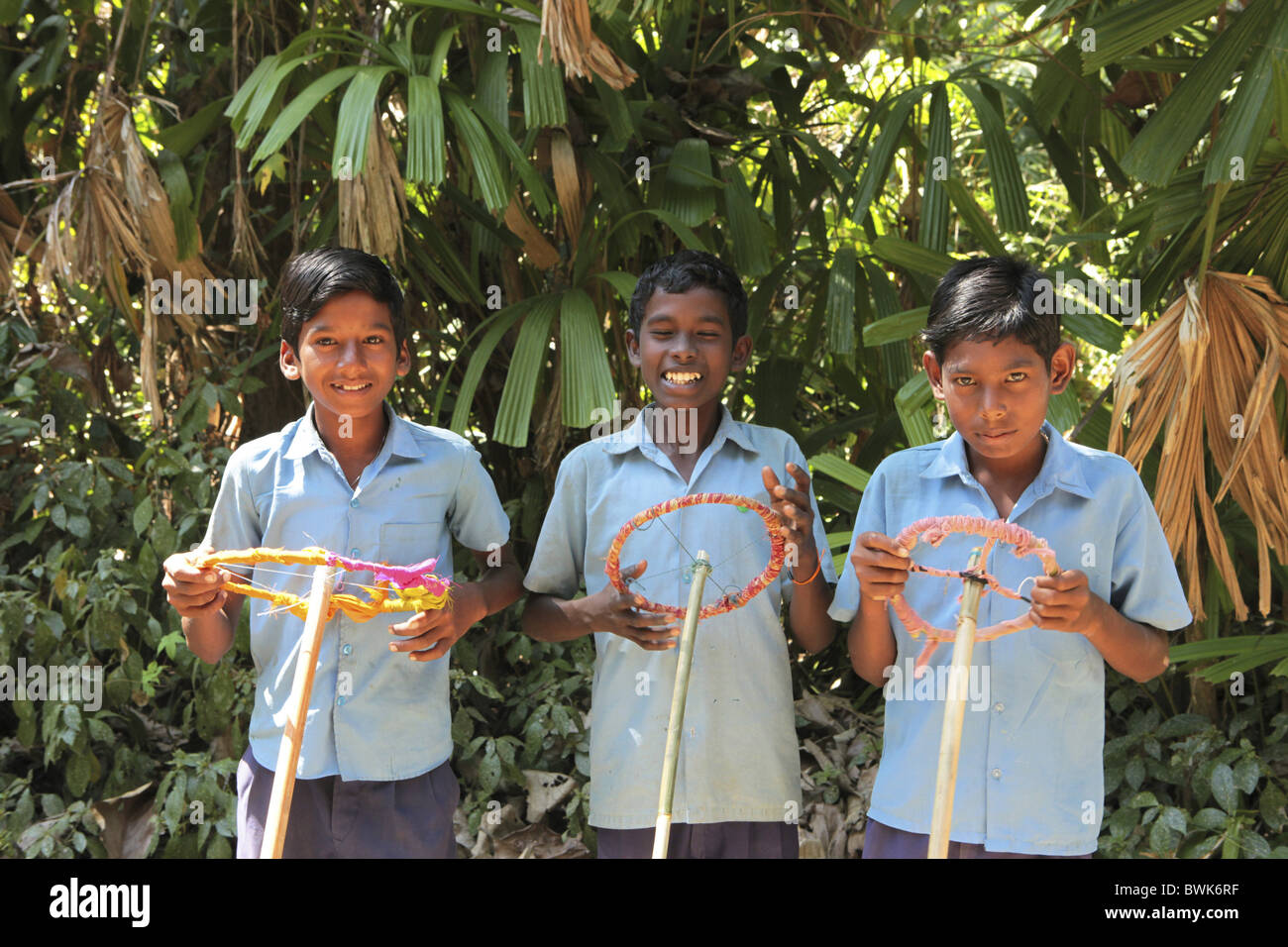 Boys in their school uniform playing car, Baratang, Middle Andaman, Andamans, India Stock Photo