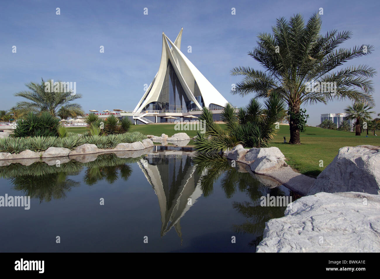 water pond clubhouse club house moulder architecture gulf golf construction golf course Dubai Creek gulf go Stock Photo