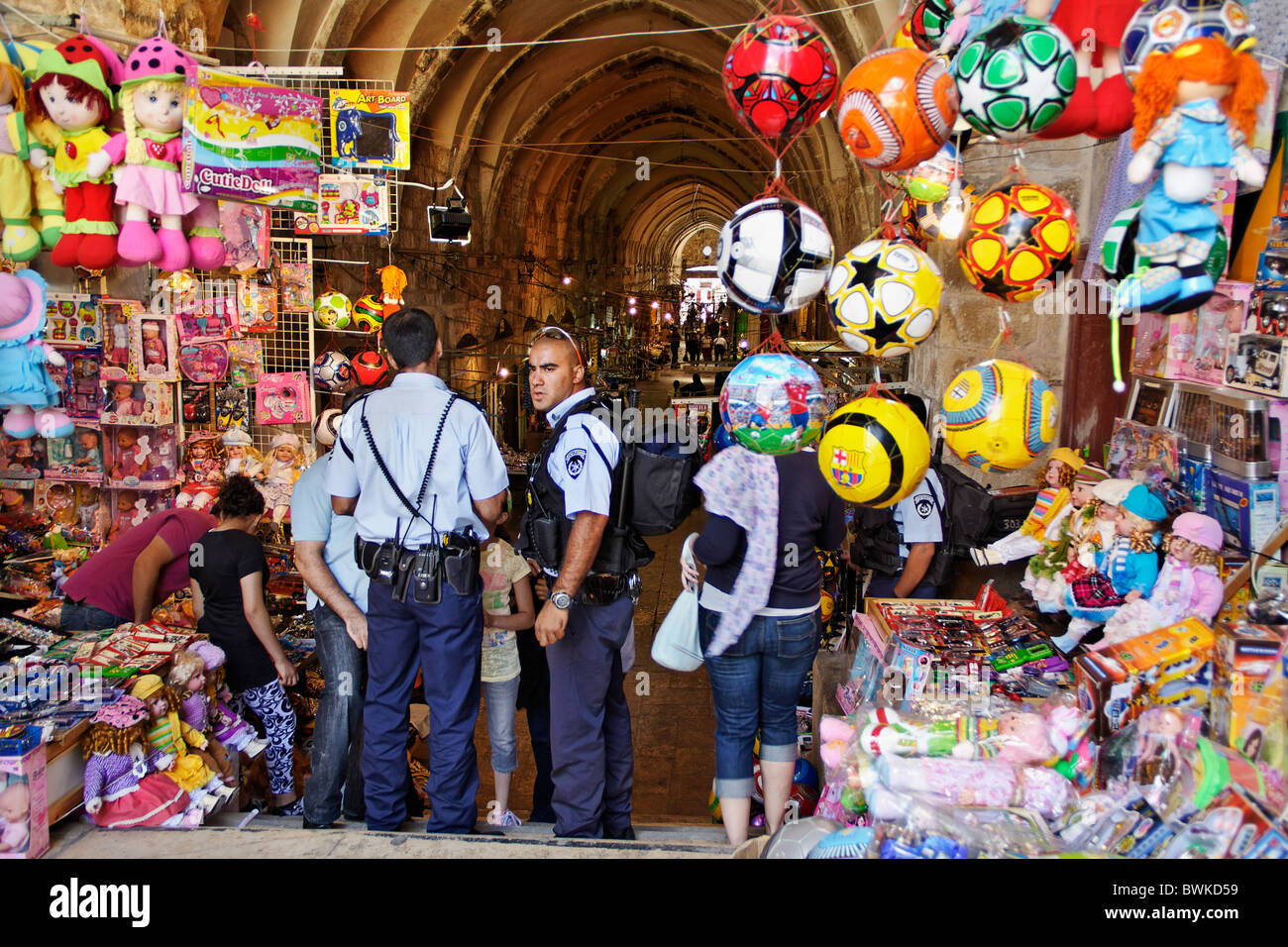 Police at a gate of old city, inspect identity documents Stock Photo