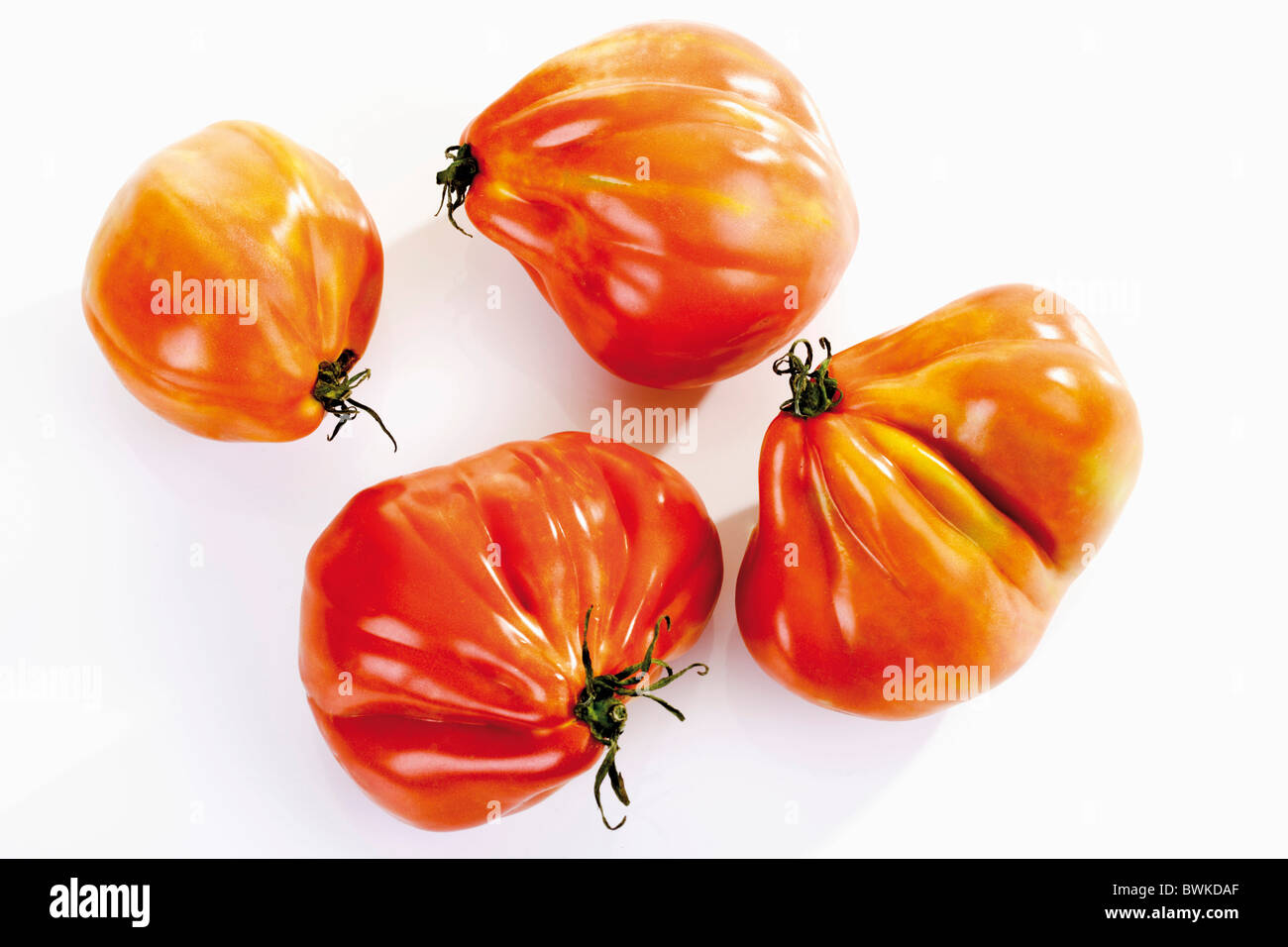 Four beef heart tomatoes Stock Photo Alamy