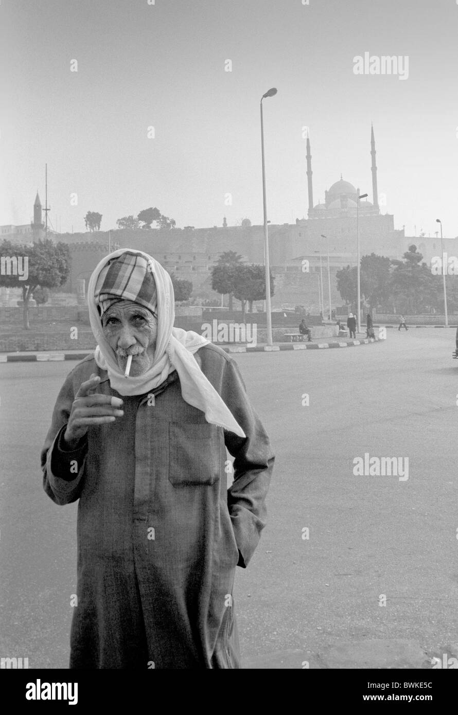 Egypt North Africa Cairo boss senior citizen Outside man cigarette Smoking smoking place space stronghold Stock Photo