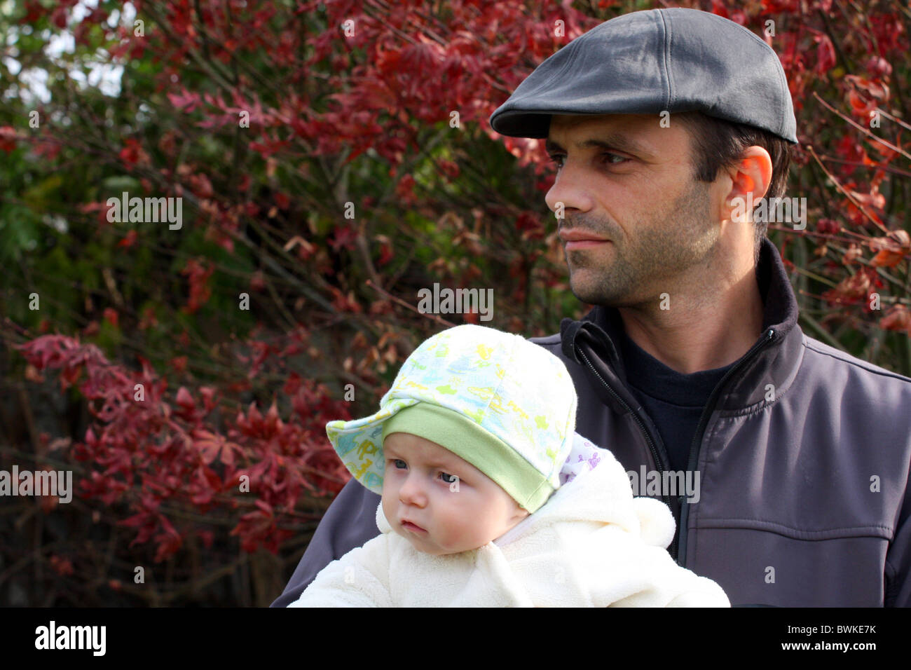 Father with his baby son looking at something. Stock Photo