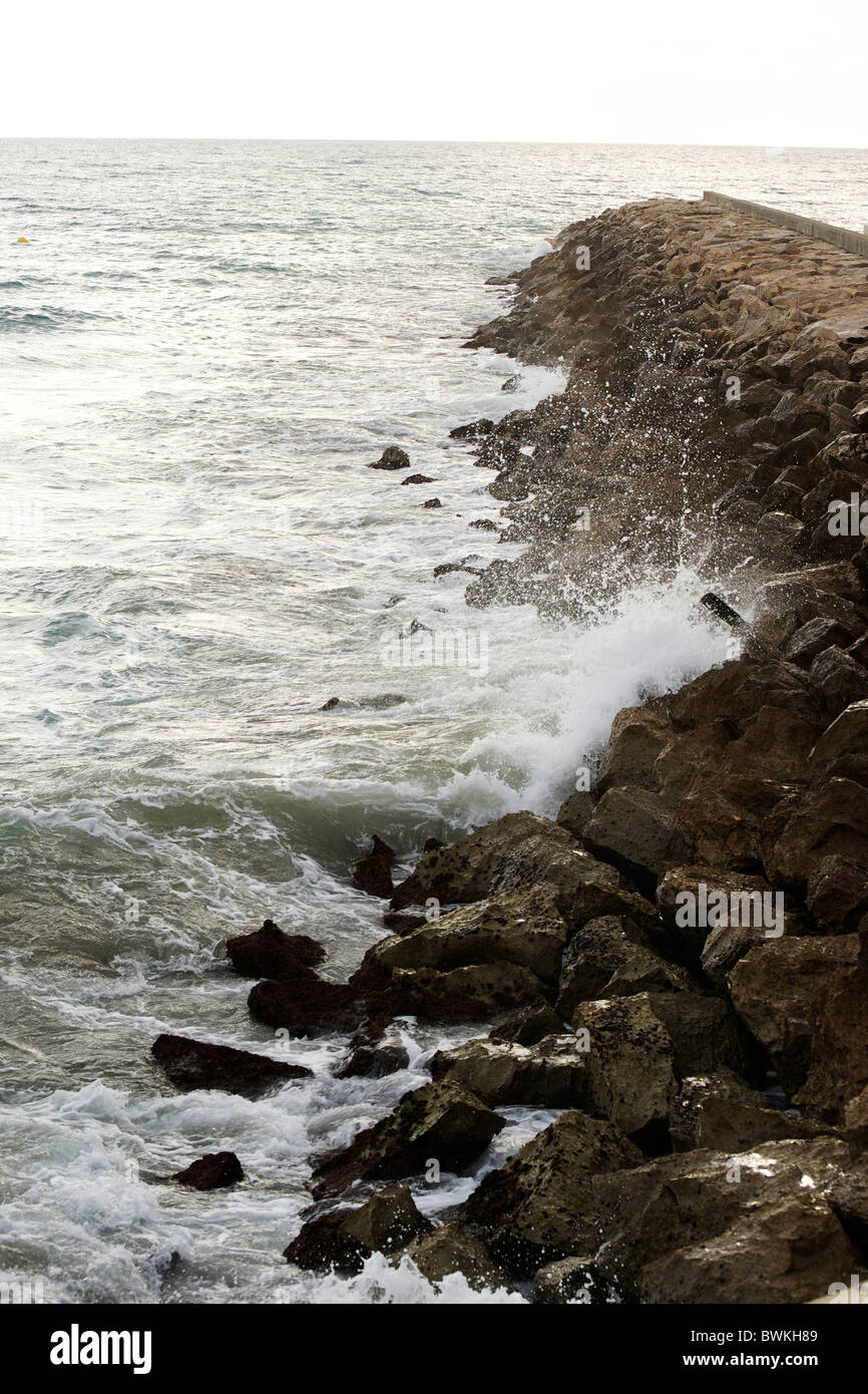 Seawall made of rocks Stock Photo Alamy