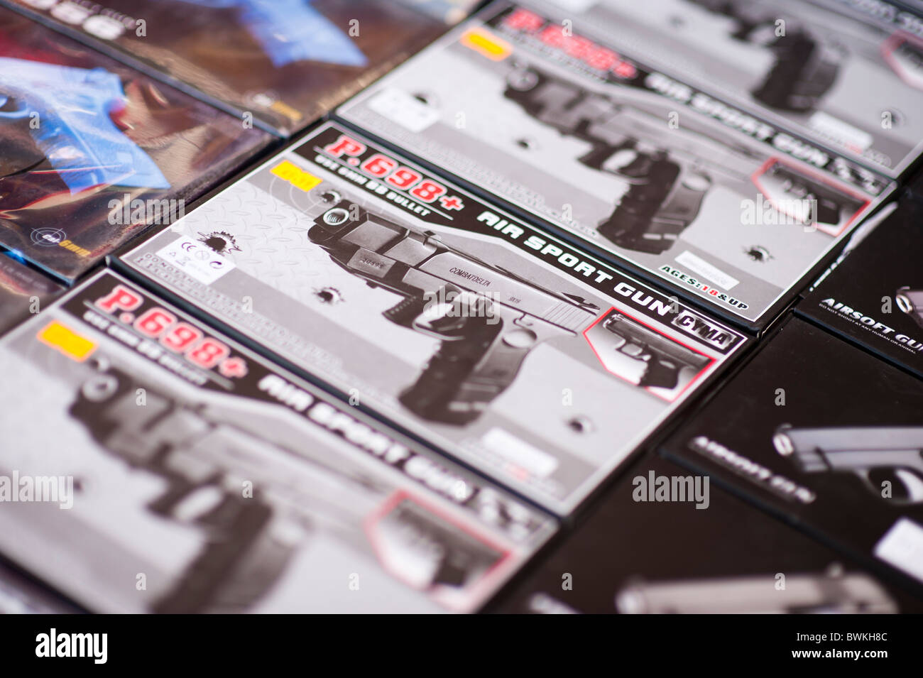boxes of air pellet bebe guns on sale at a street market UK Stock Photo