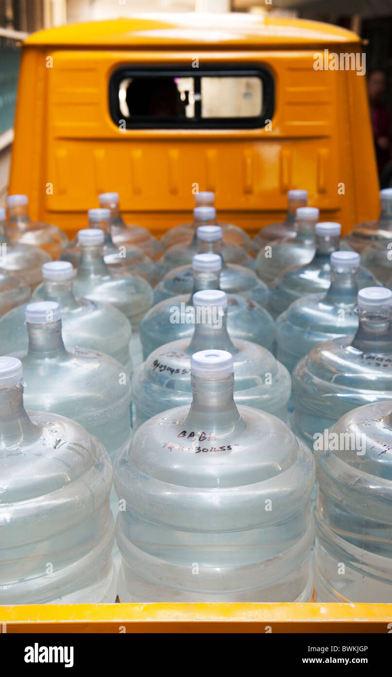 Purified mineral drinking water bottles in a lorry. Andhra Pradesh, India Stock Photo
