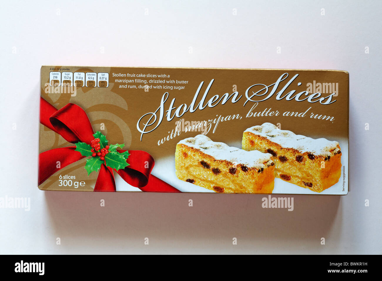 Box of stollen slices with marzipan butter and rum isolated on white background Stock Photo