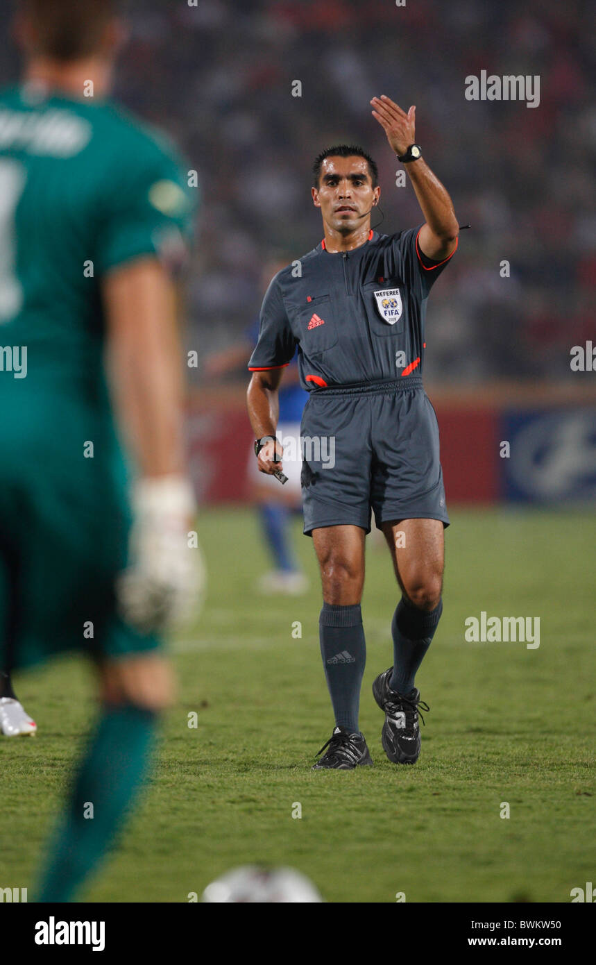 Referee Marco Rodriguez signals for Italy goalkeeper Vincenzo Fiorillo to resume play during a 2009 FIFA U-20 World Cup match Stock Photo