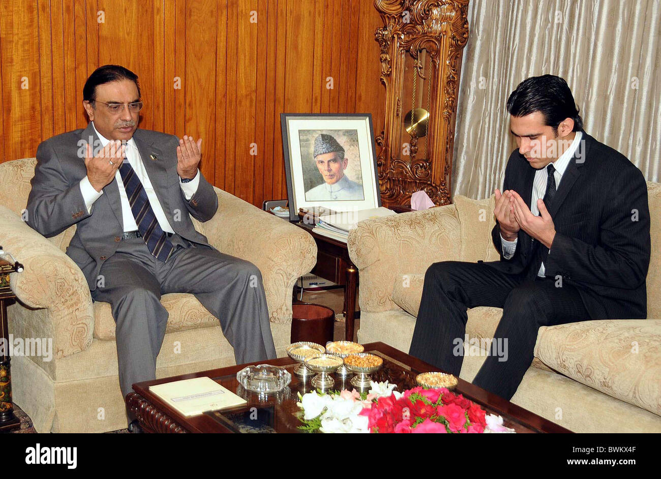 President, Asif Ali Zardari along with Aezaz-ur-Rehman offers Dua (pray) for her mother Shama Khalid, former Governor Stock Photo