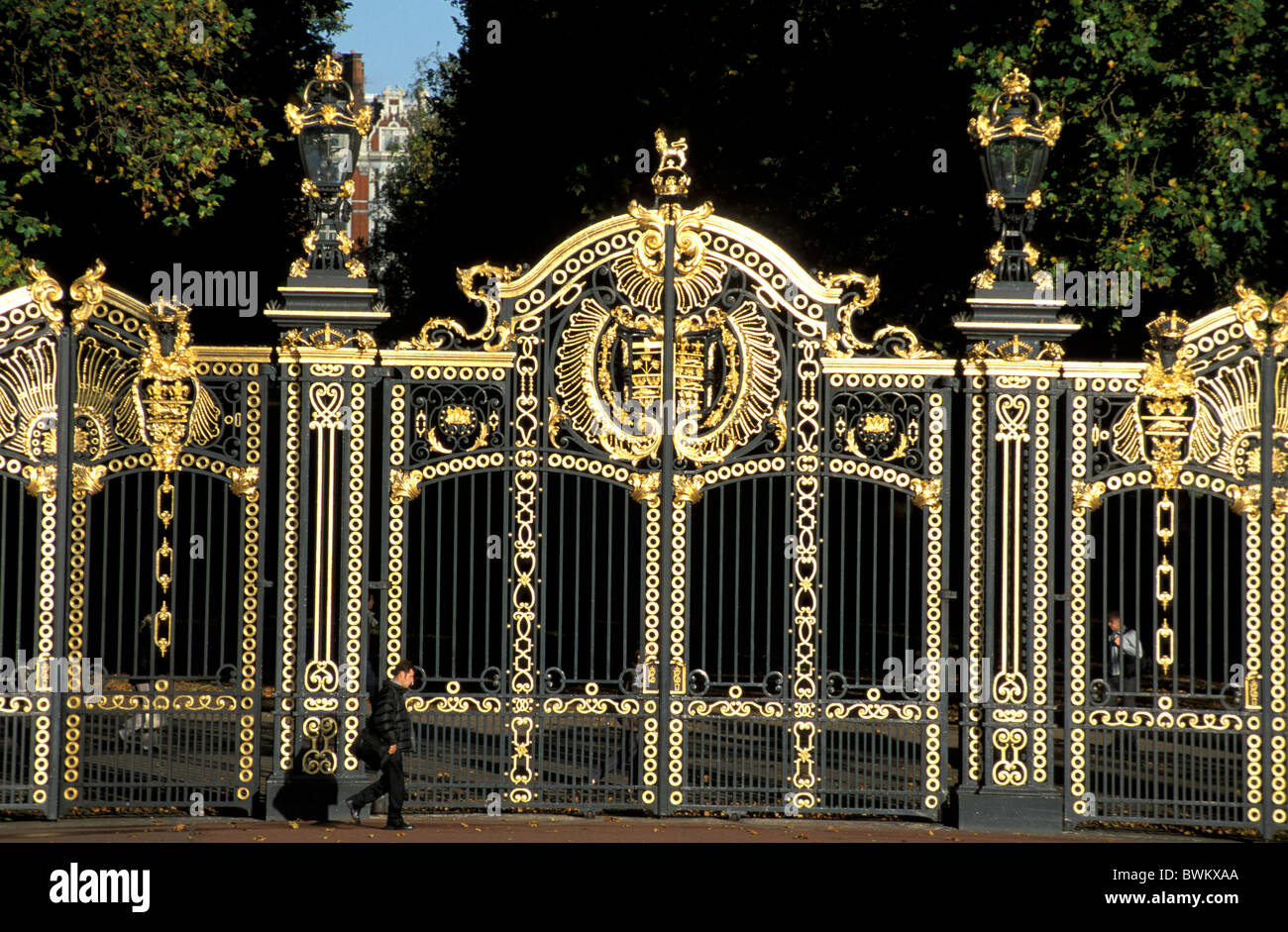 UK London Buckingham Palace Green Park Gates Gate Great Britain Europe England fence gold golden crest ro Stock Photo