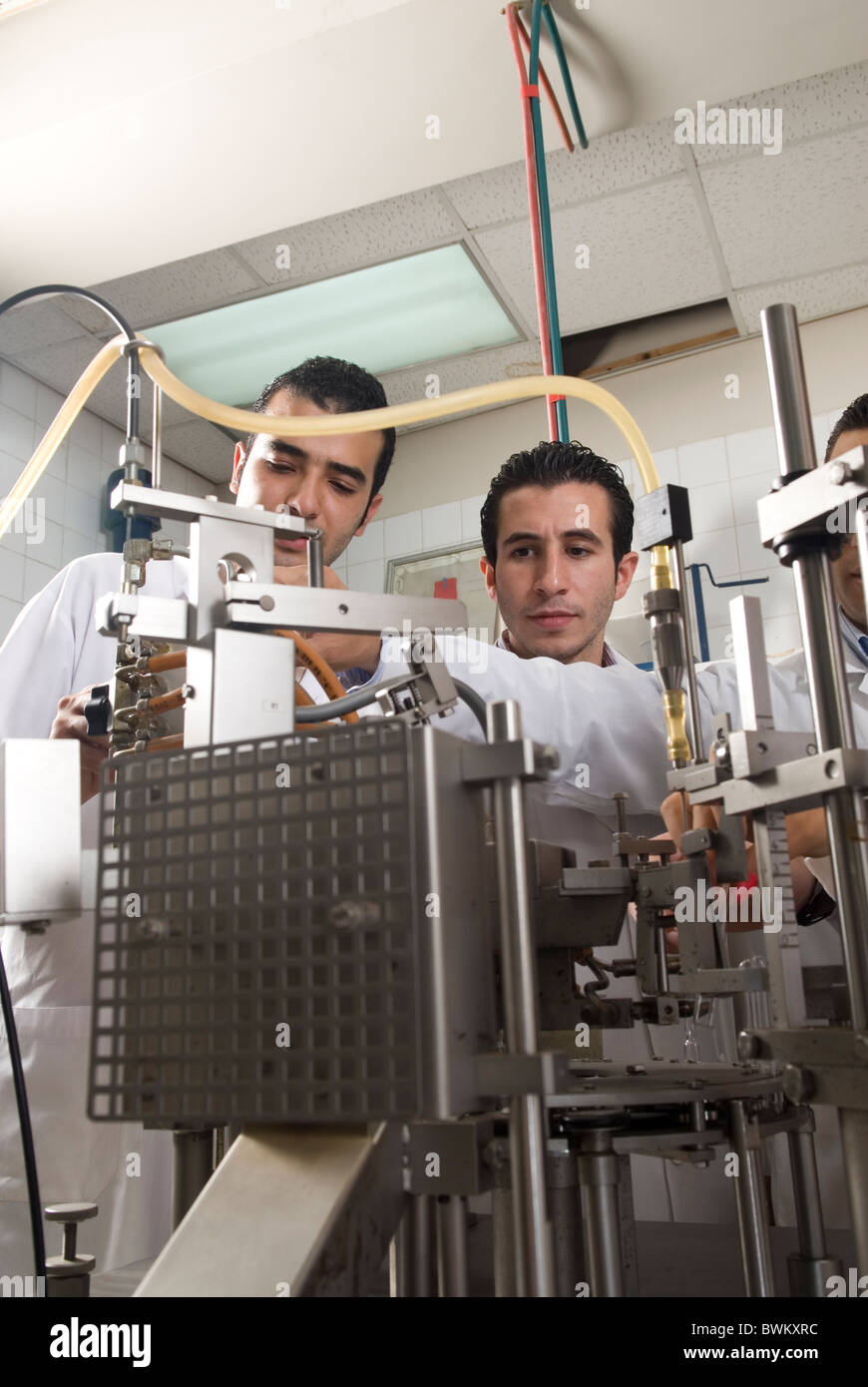 Students working on a medical machine inside a laboratory at the Beirut Arab University Lebanon Middle East Stock Photo