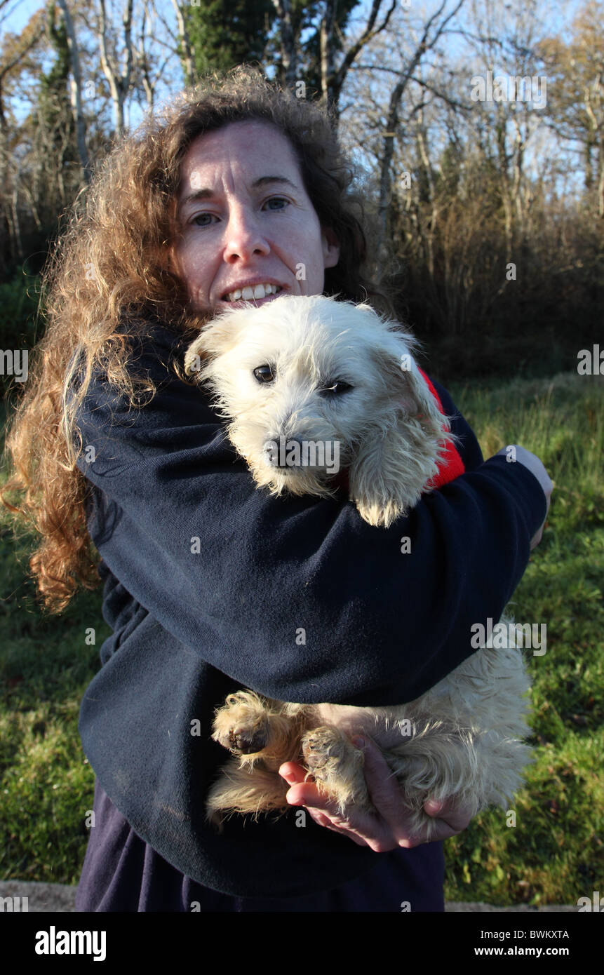 Milly, kennelmaid at ISPCA with terrier puppy in need of a home Stock Photo