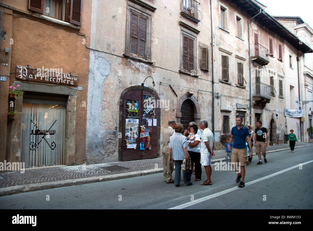 People chat in the street, early evening Corso San Giuseppe, Leonessa, Province of Rieti, Lazio, Italy Stock Photo