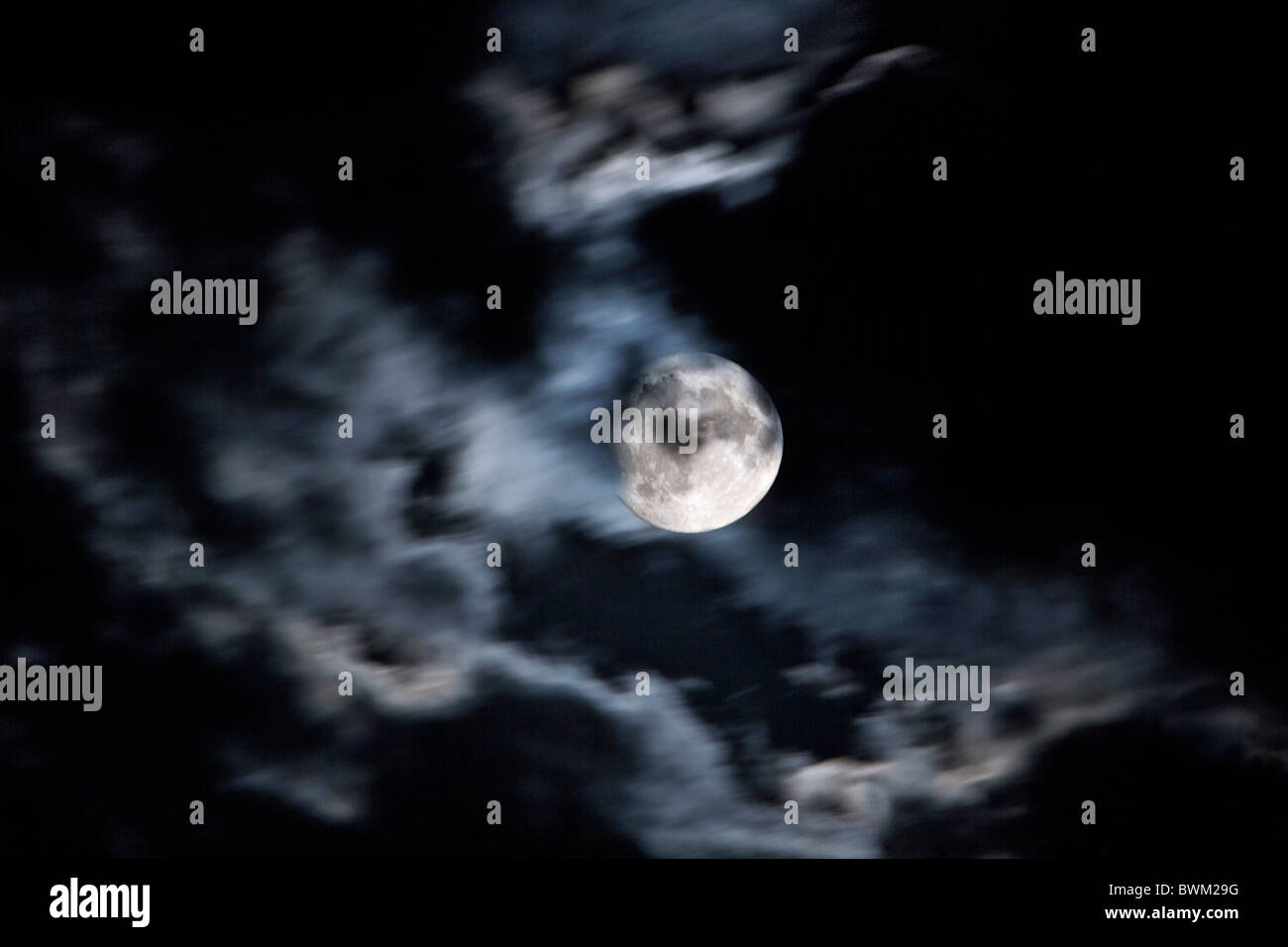 Full Moon cloudy night sky blurred dark Stock Photo