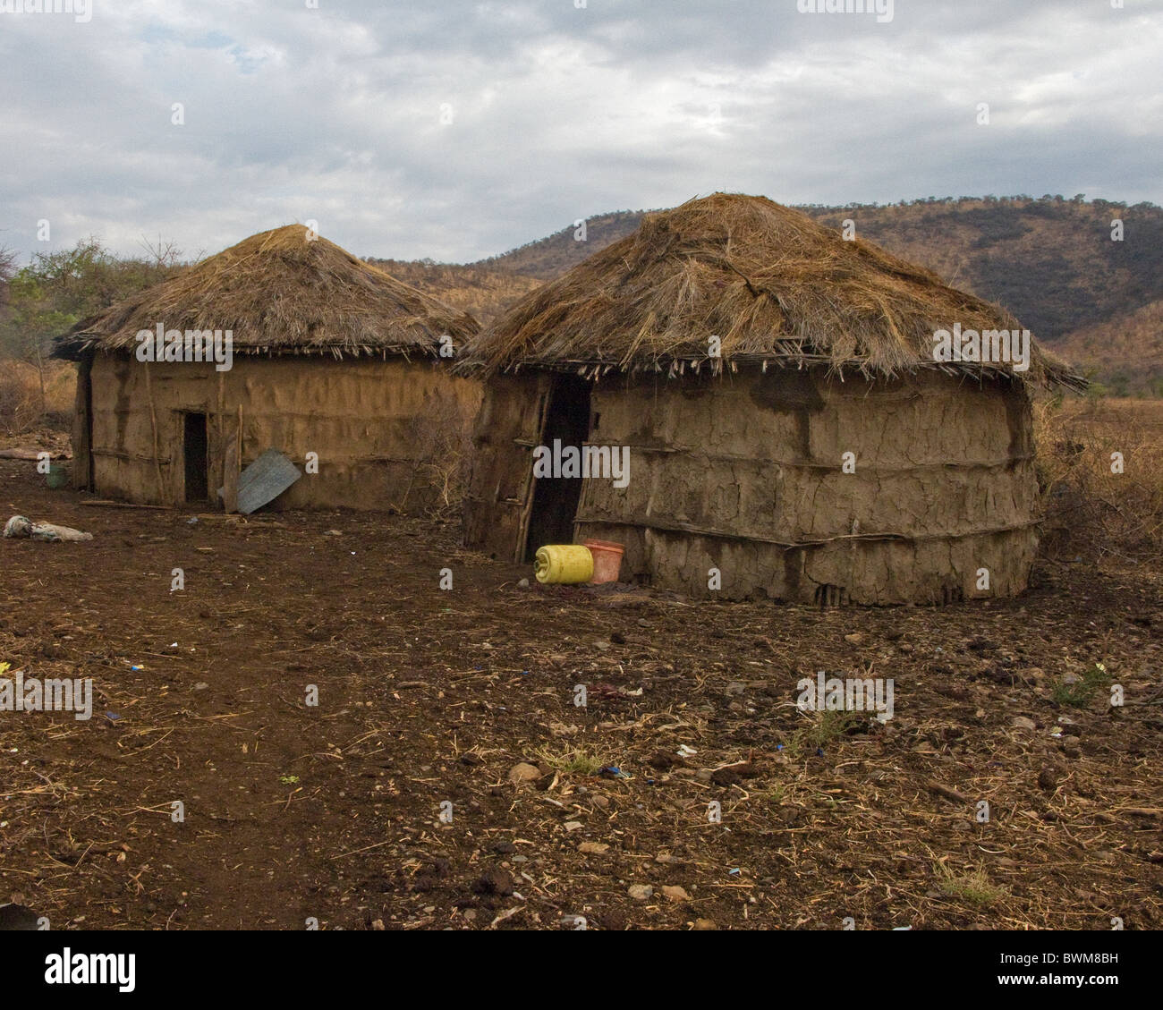 Traditional Masai mud and thatch huts in Tanzania. Stock Photo