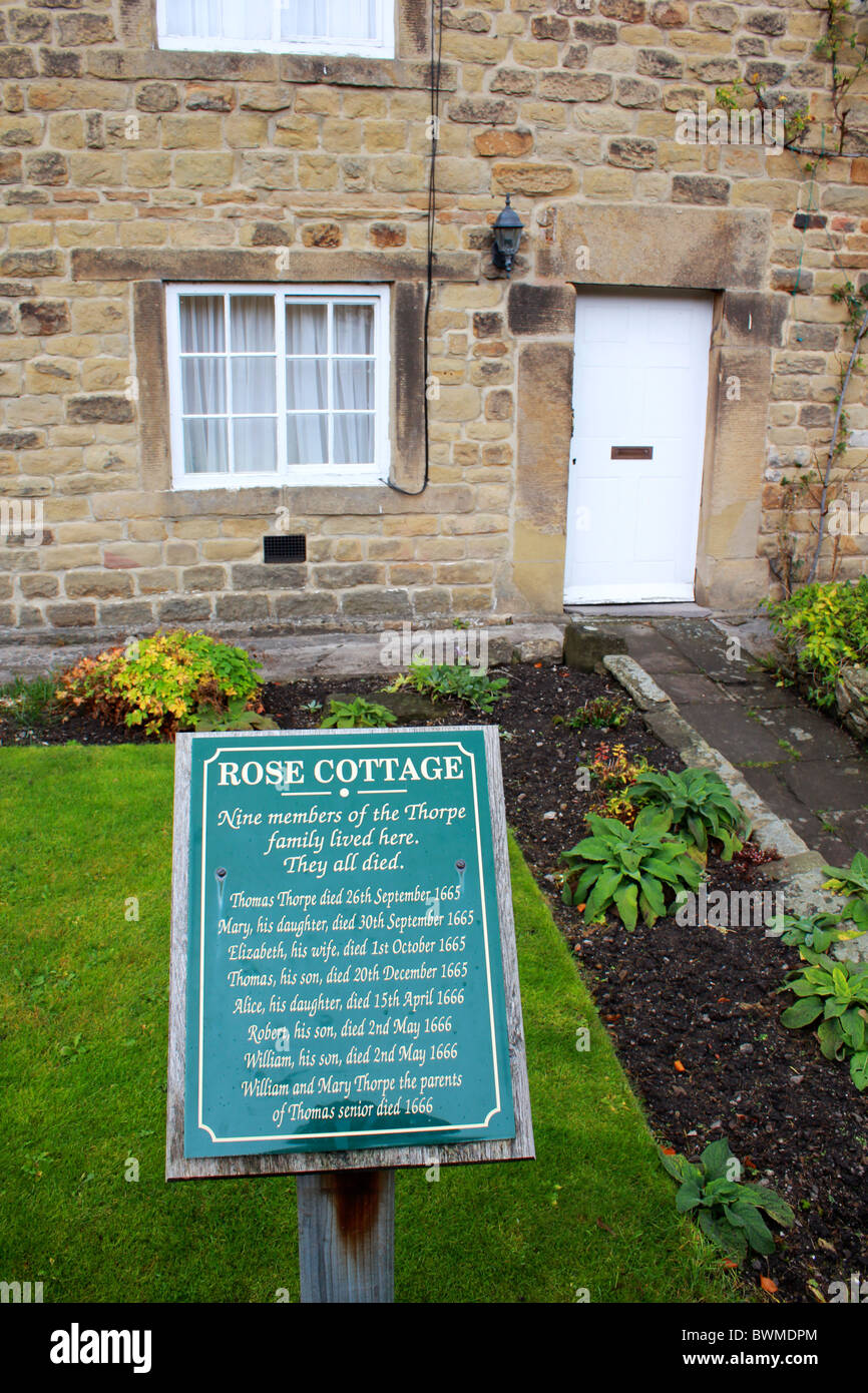 A plaque remembering the residents of Rose Cottage in Eyam who died in the plague. Stock Photo