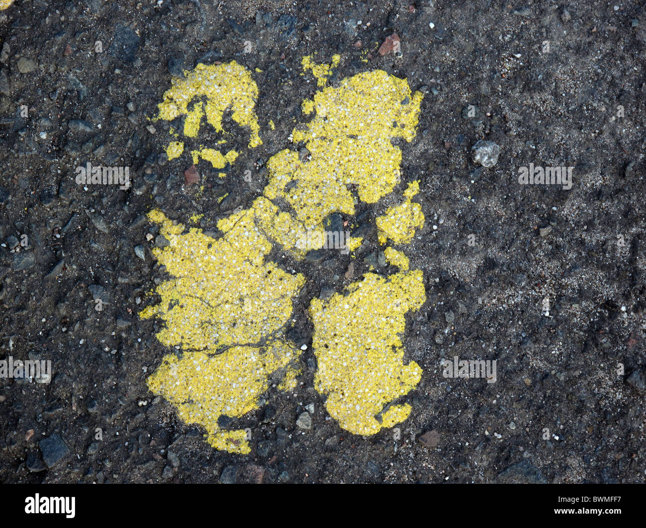 Cracked yellow paint on the tarmac close up Stock Photo Alamy