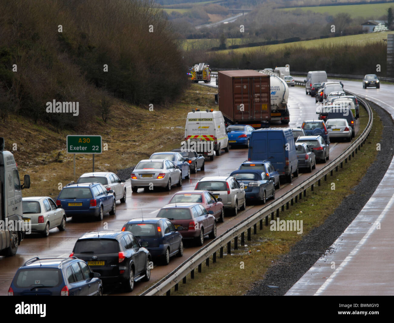 Traffic Jam A30 22 miles west of Exeter Devon UK following crash on frozen rain fire engine at front Stock Photo