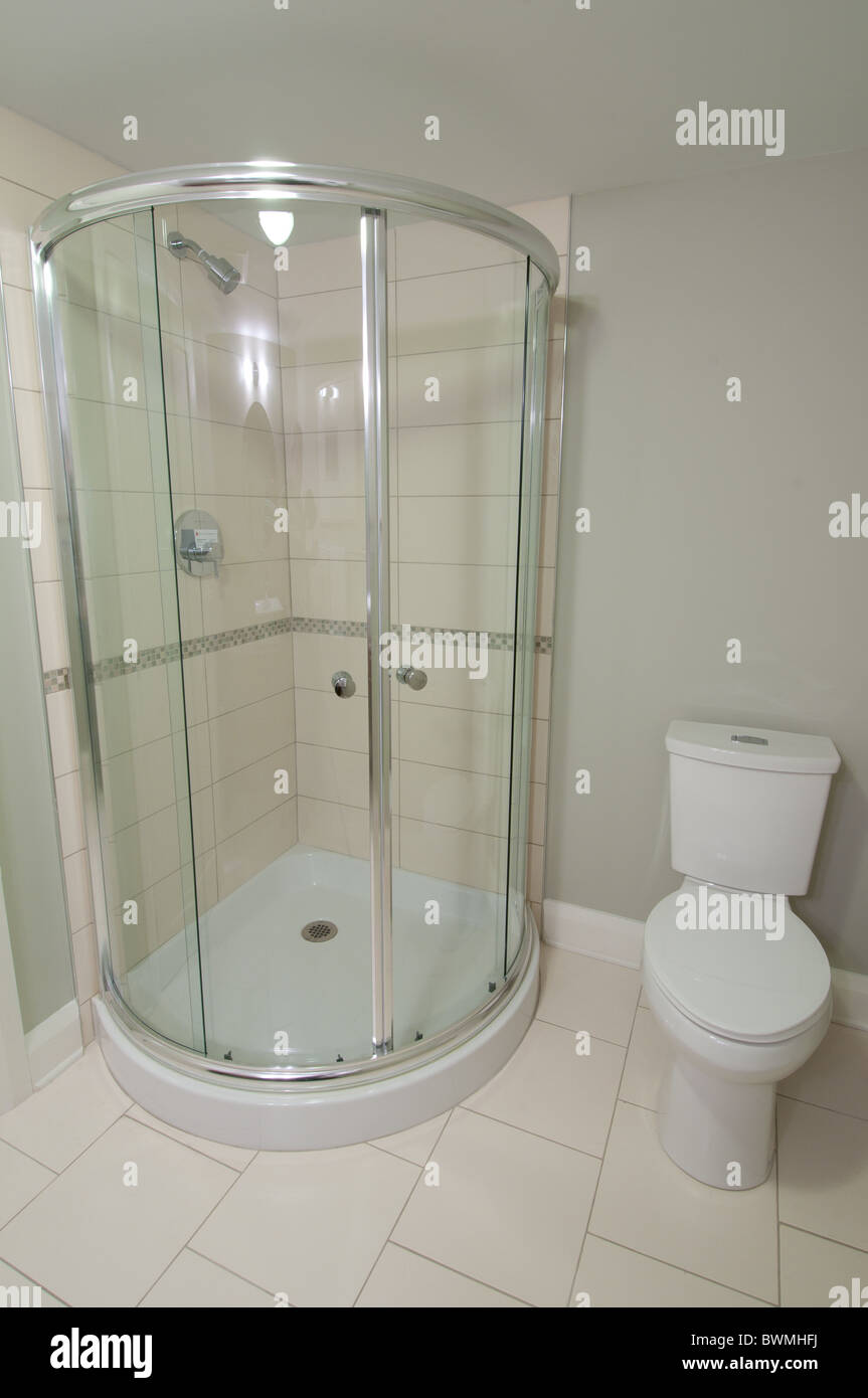 Shower stall and toilet in a luxury residential basement bathroom. Stock Photo