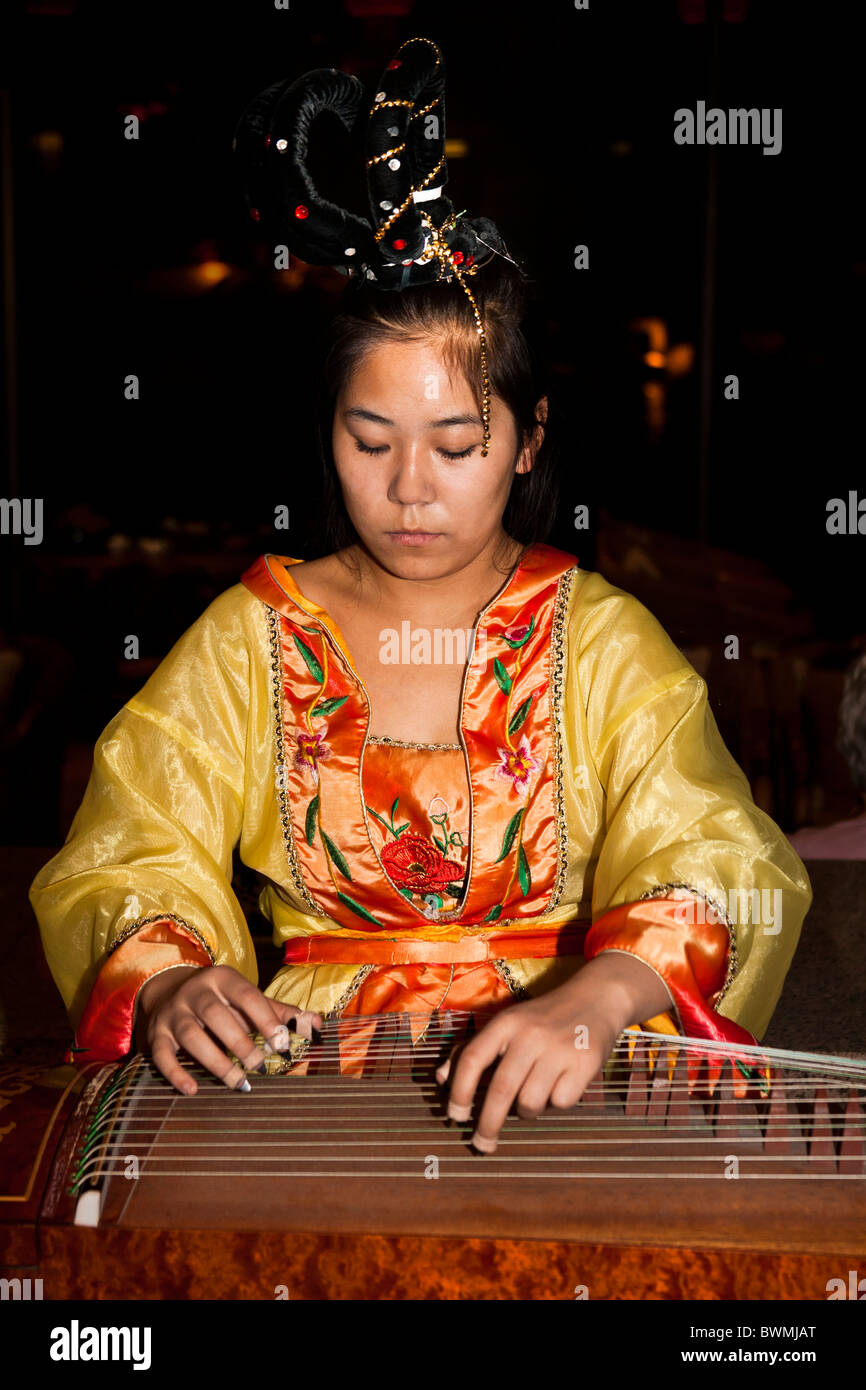 Female chinese musician traditional clothes hires stock photography