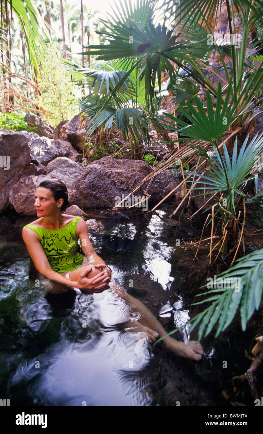 Woman relaxing in thermal spring, El Questro,  Western Australia Stock Photo