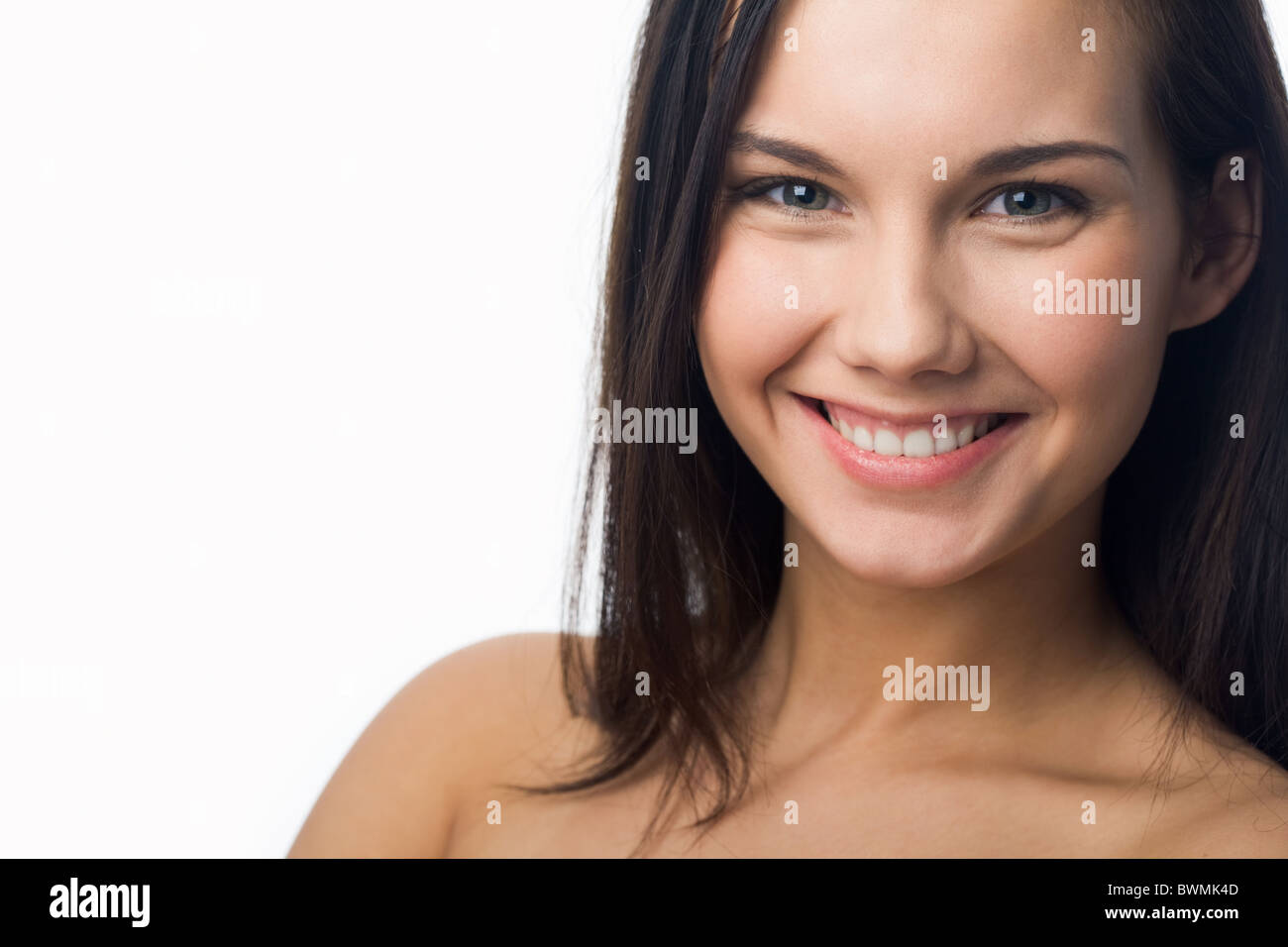 Portrait of charming girl looking at camera and laughing Stock Photo ...