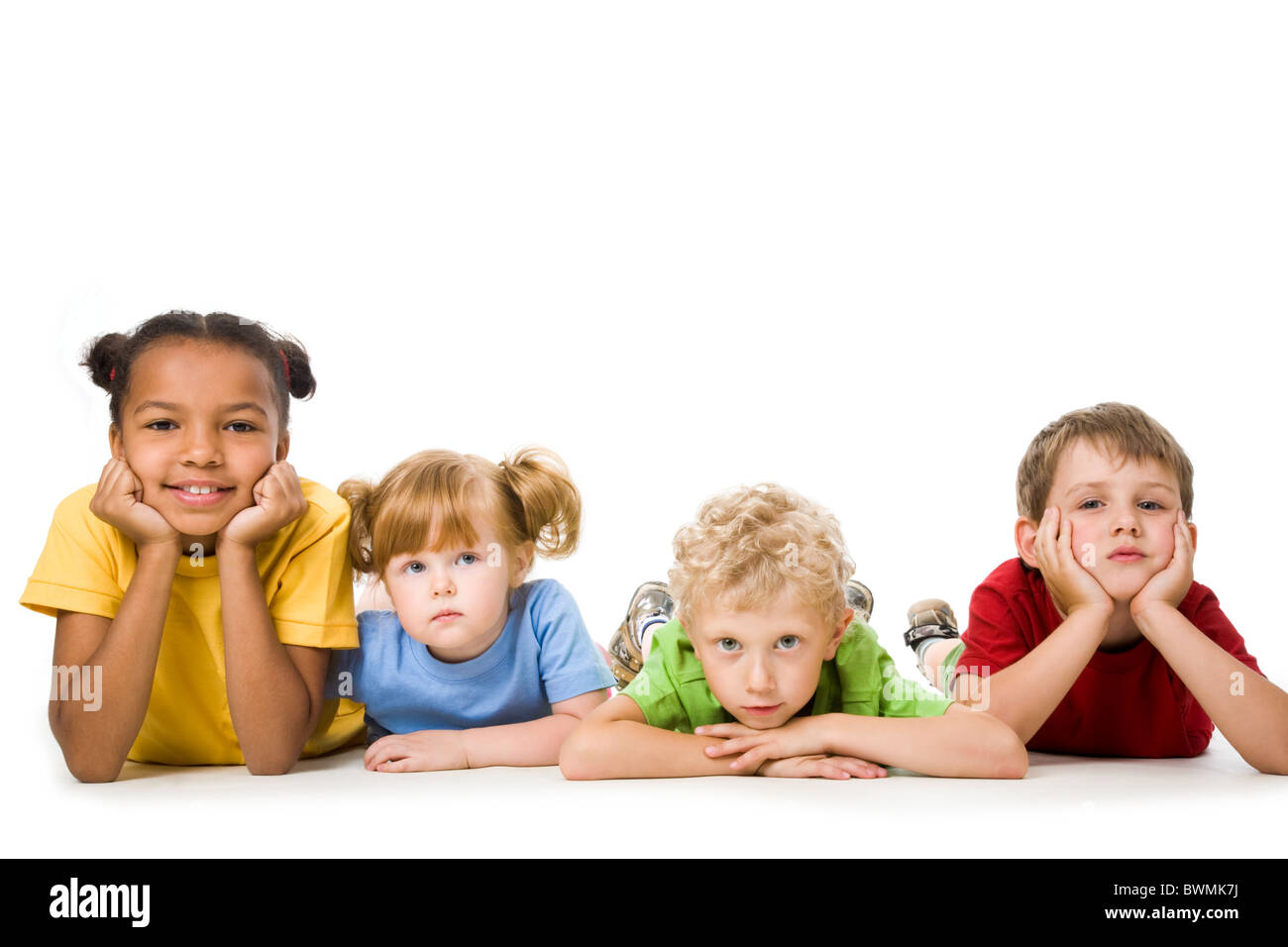 Portrait of four children lying in a line Stock Photo