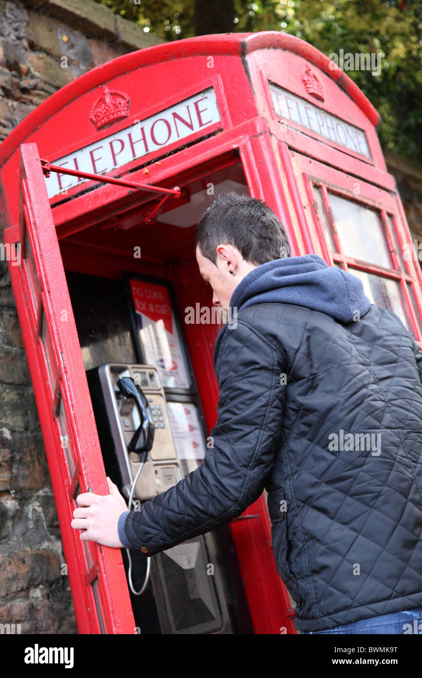 Man Using Red Telephone Person using red telephone box hi-res stock photography and images - Alamy